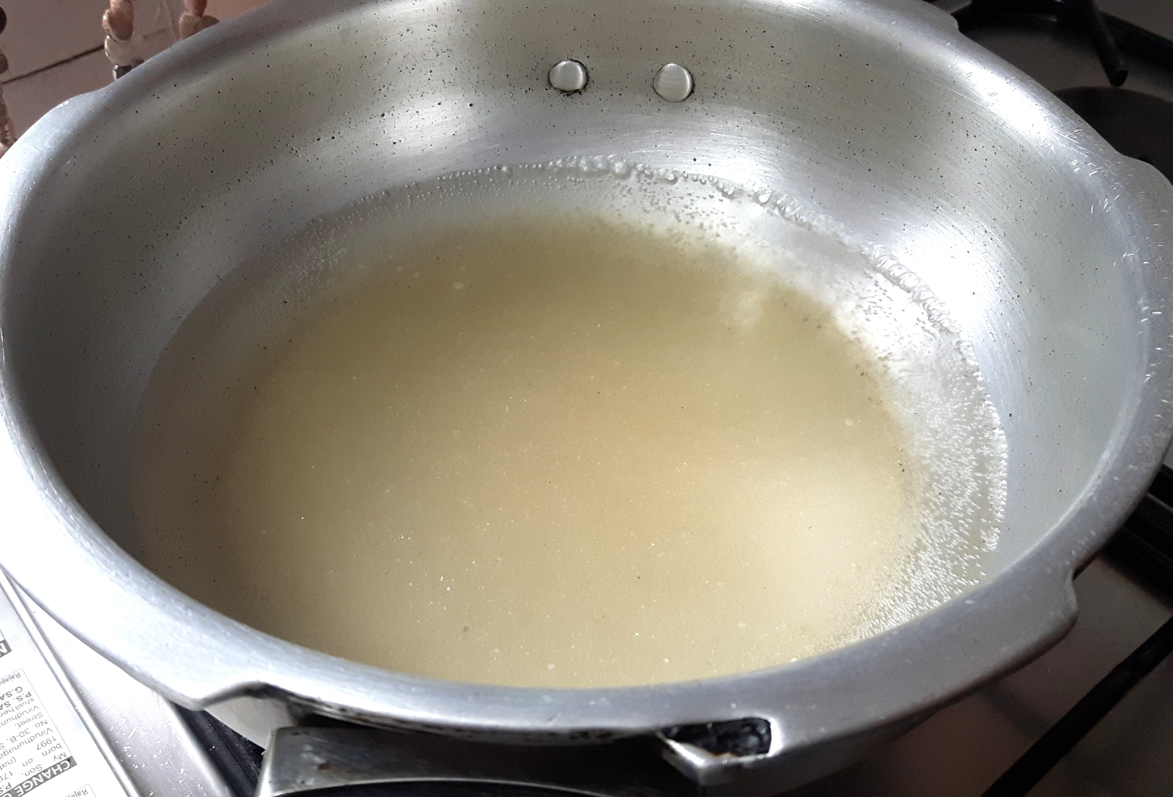 Place sugar and water in a pan