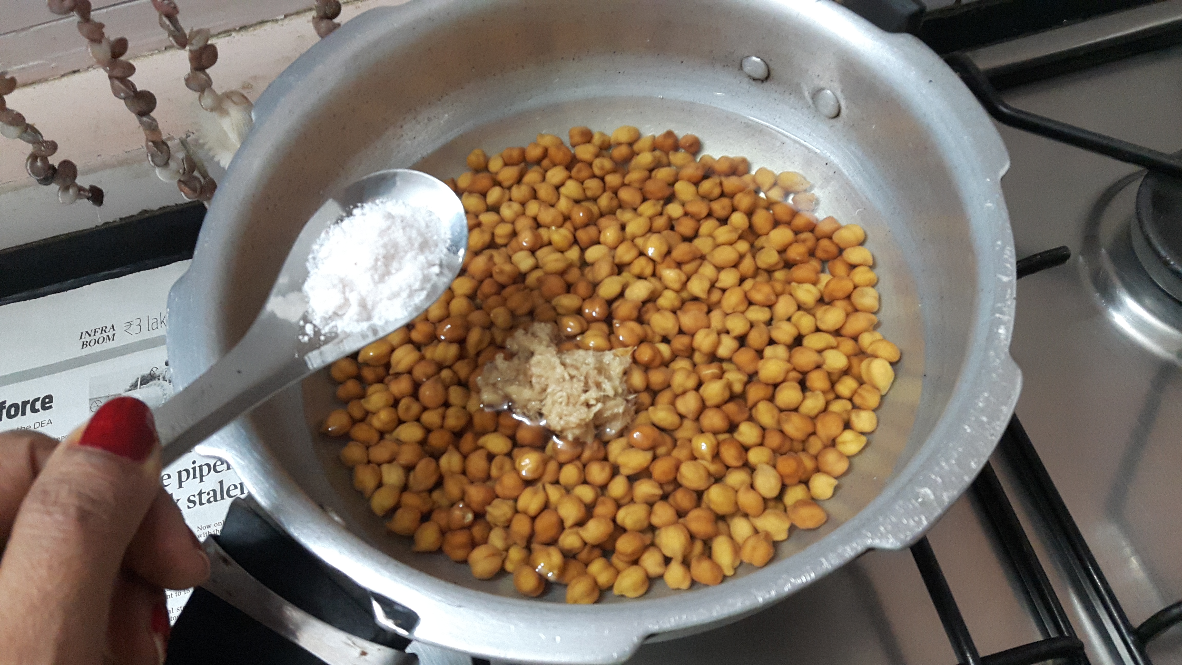 Cook kala chana along with salt and ginger paste