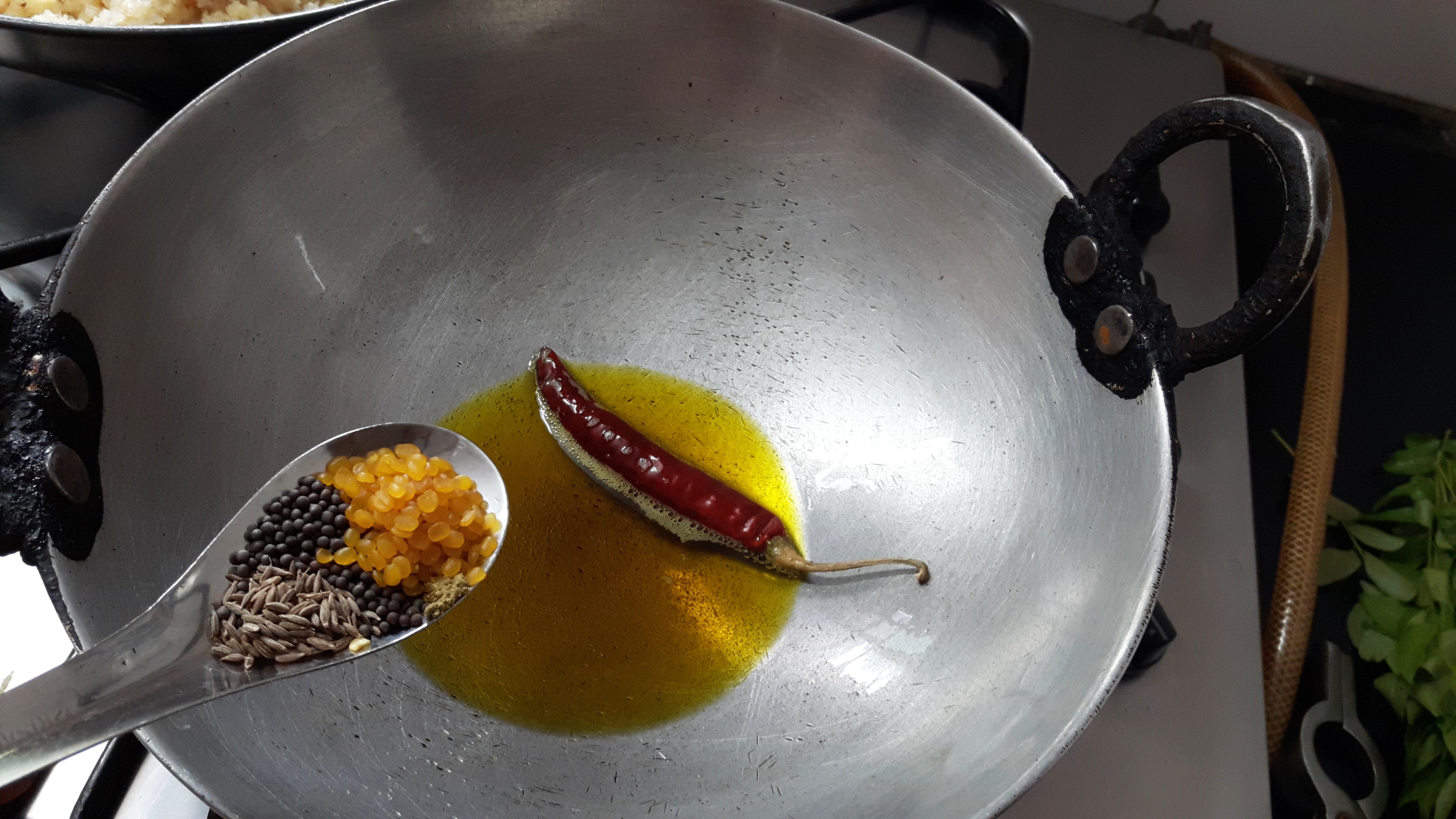 add red chili, mustard seed, cumin and split urad dal
