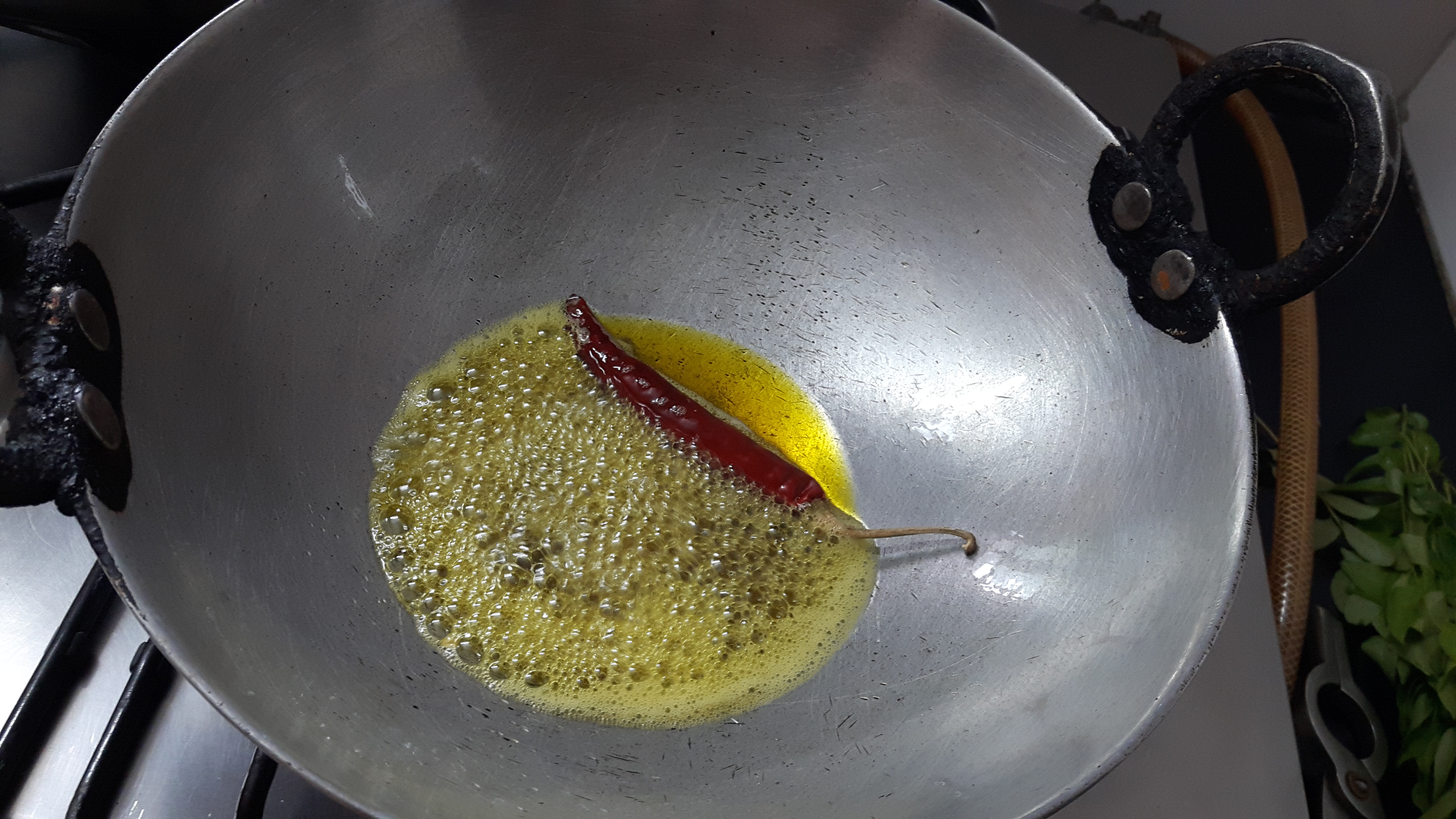add red chili, mustard seed, cumin and split urad dal