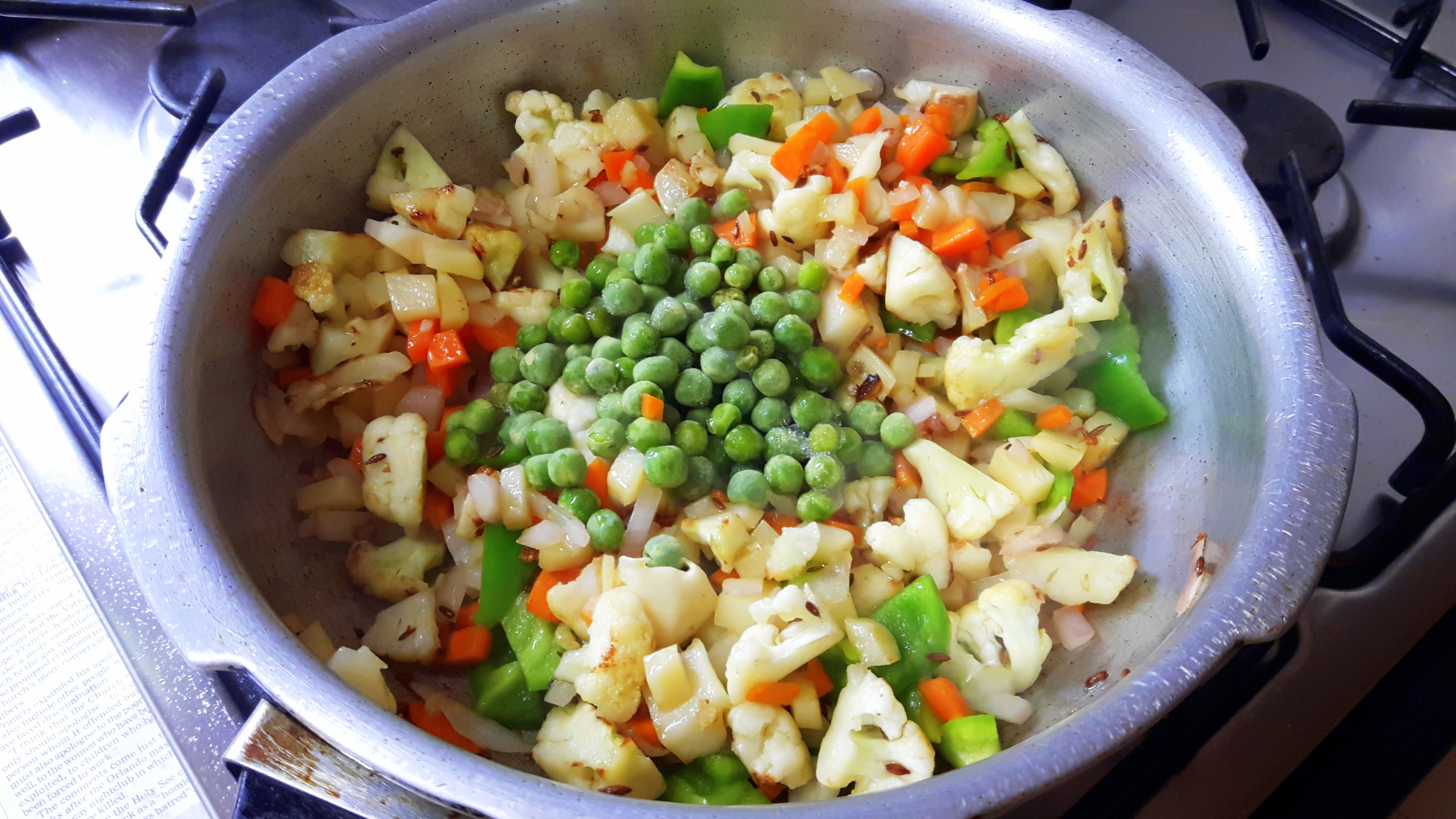 adding fresh peas
