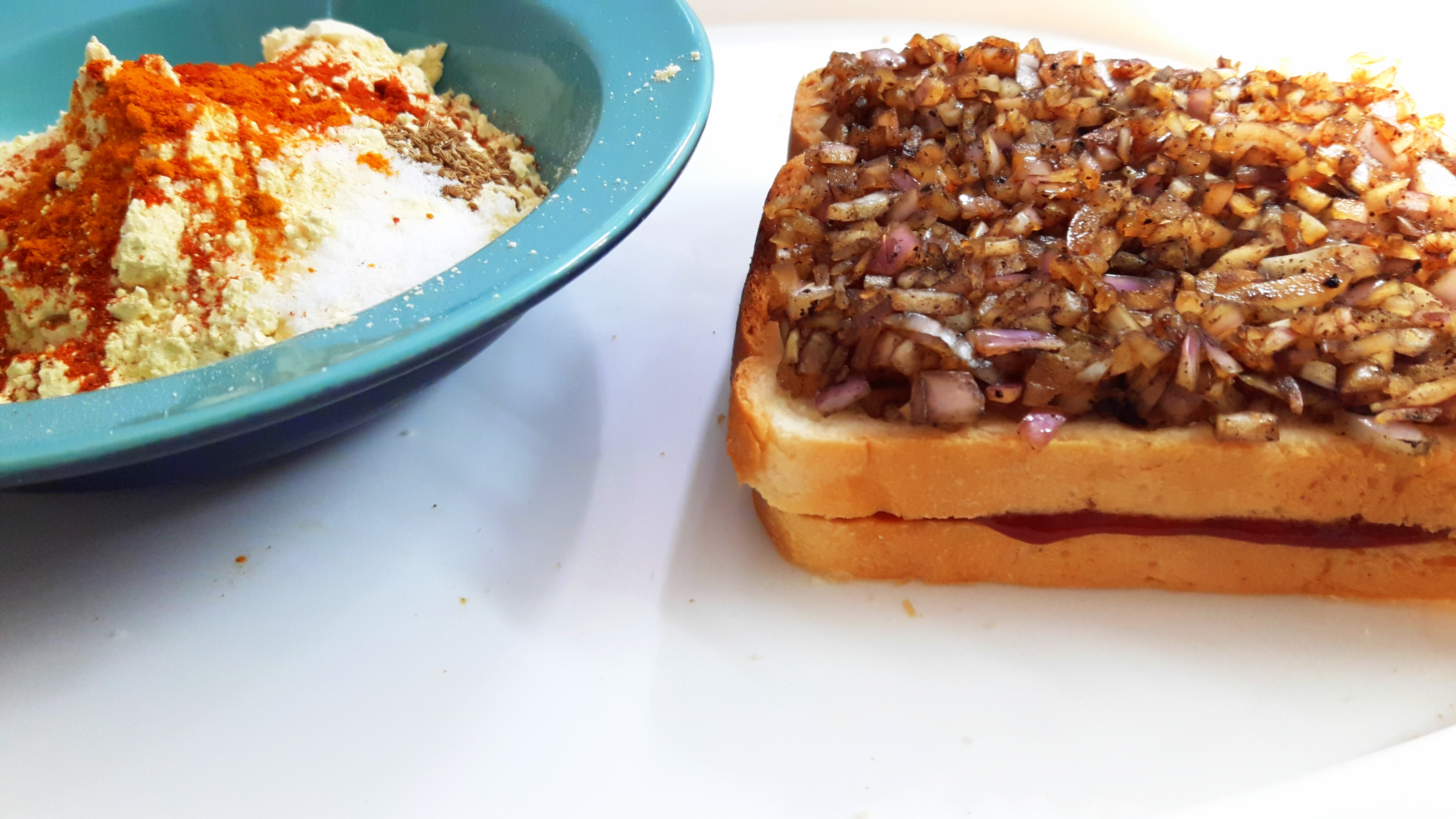 put another slice, and spread the mixture of onion and soya sauce