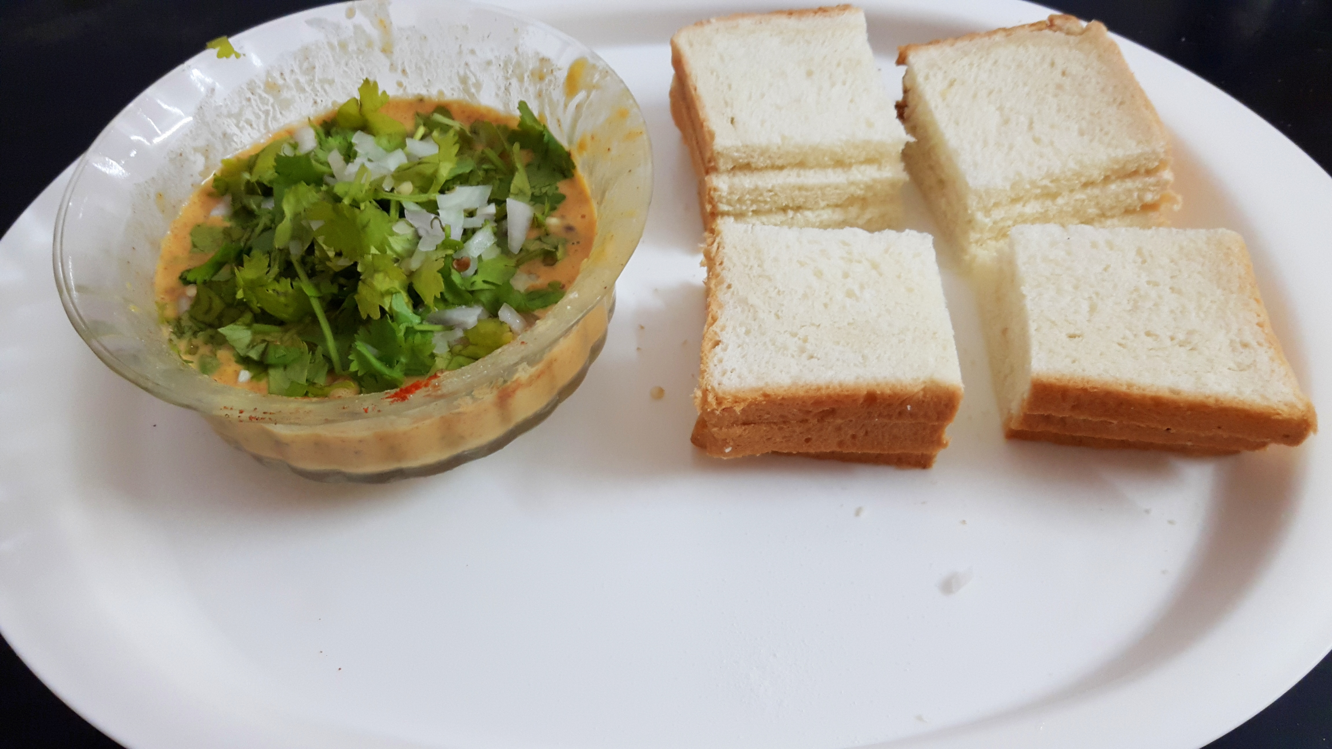 Cut the bread slice in four pieces