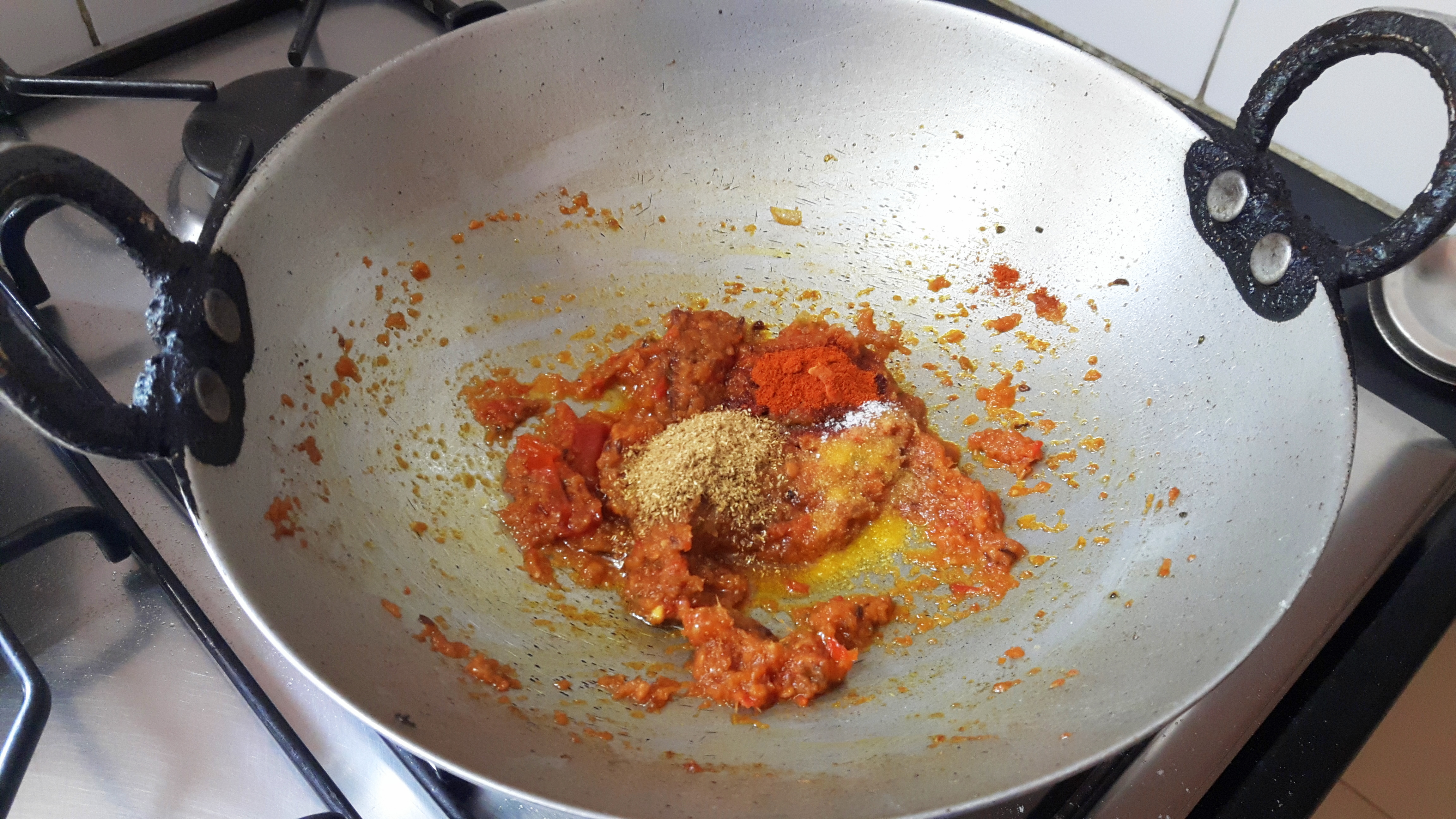 Add red chili powder, coriander powder and turmeric powder