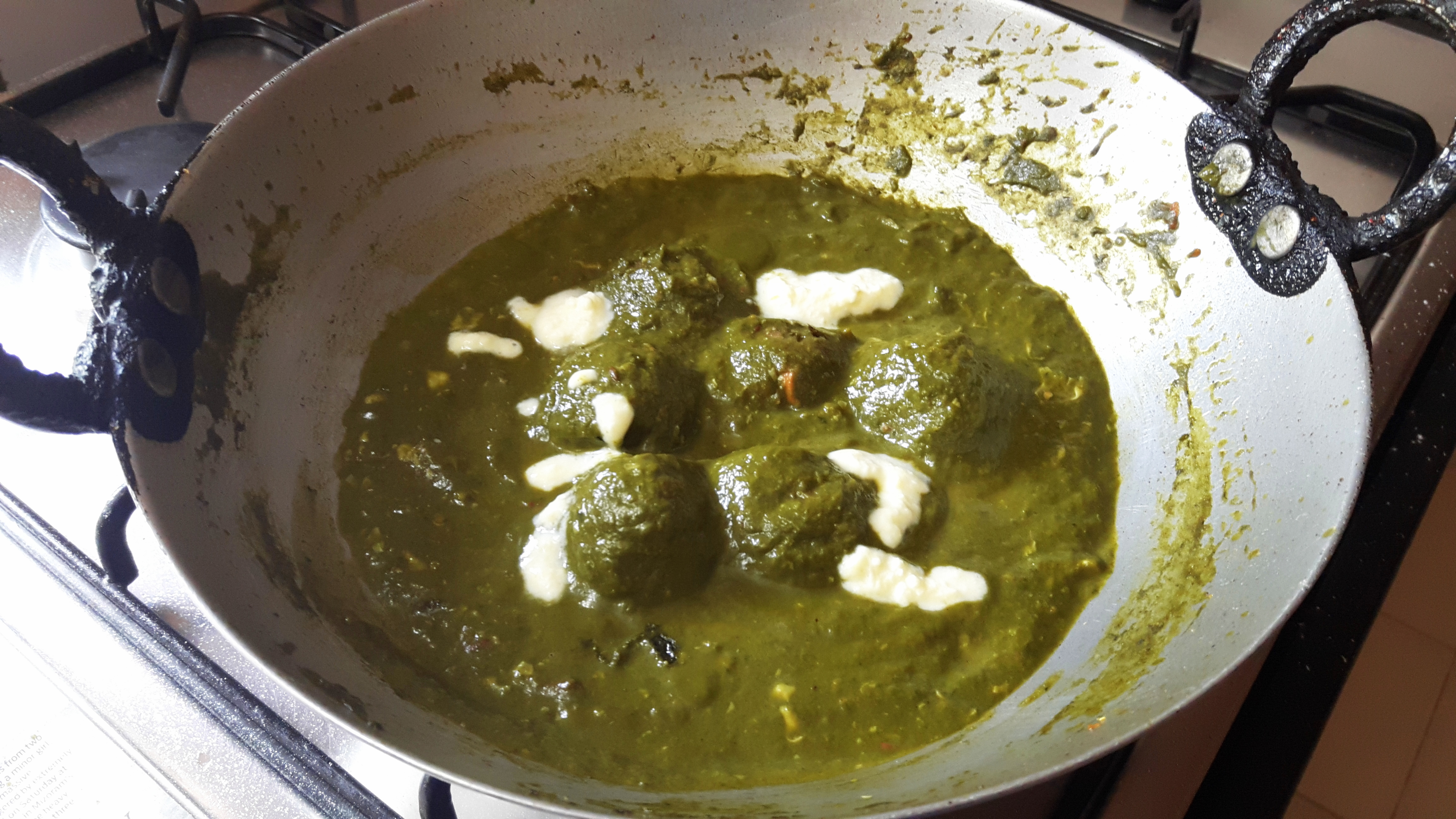 Bread kofta in palak gravy (bread kofta in spinach curry)