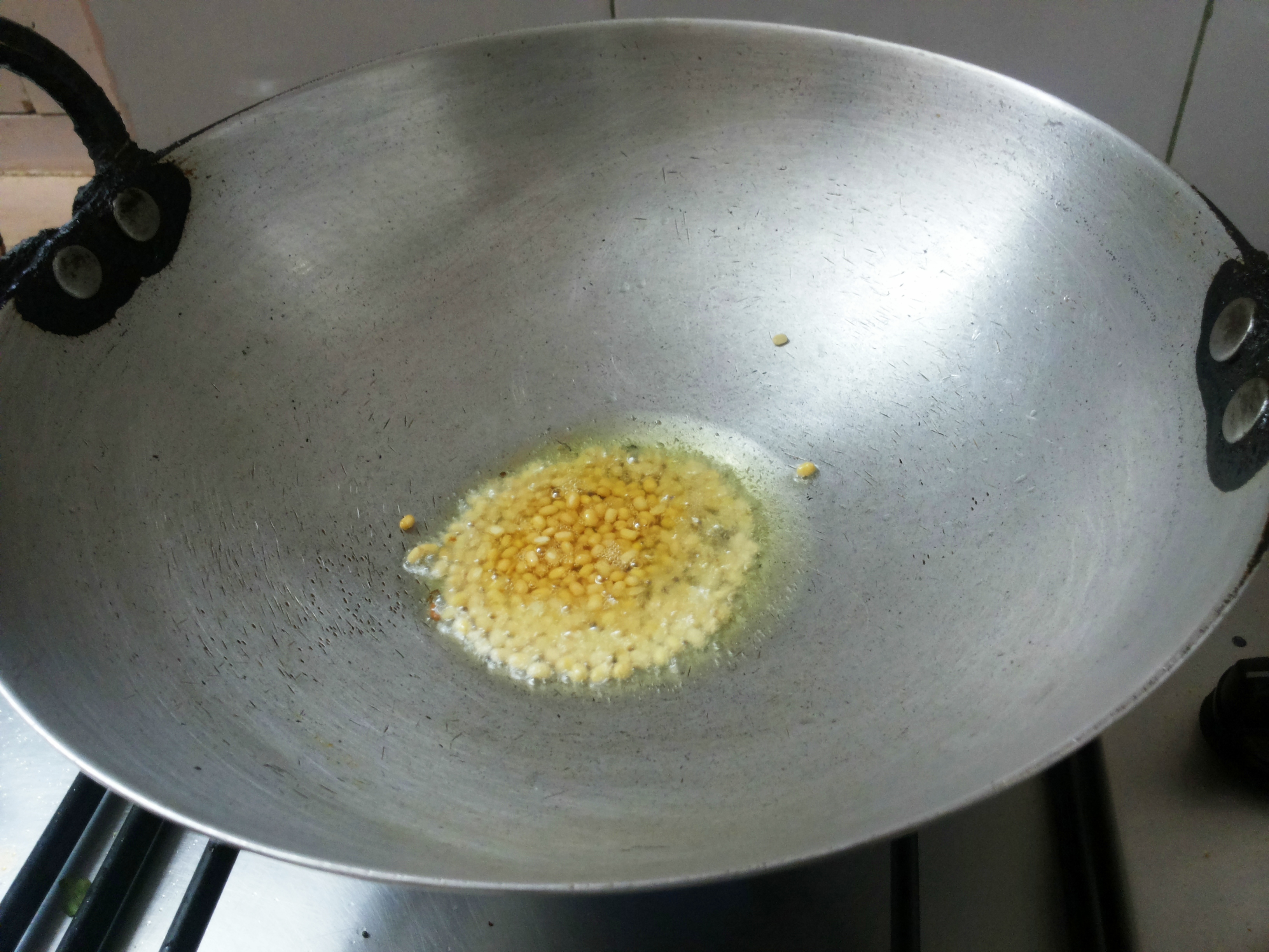 add mustard seeds, and split black gram