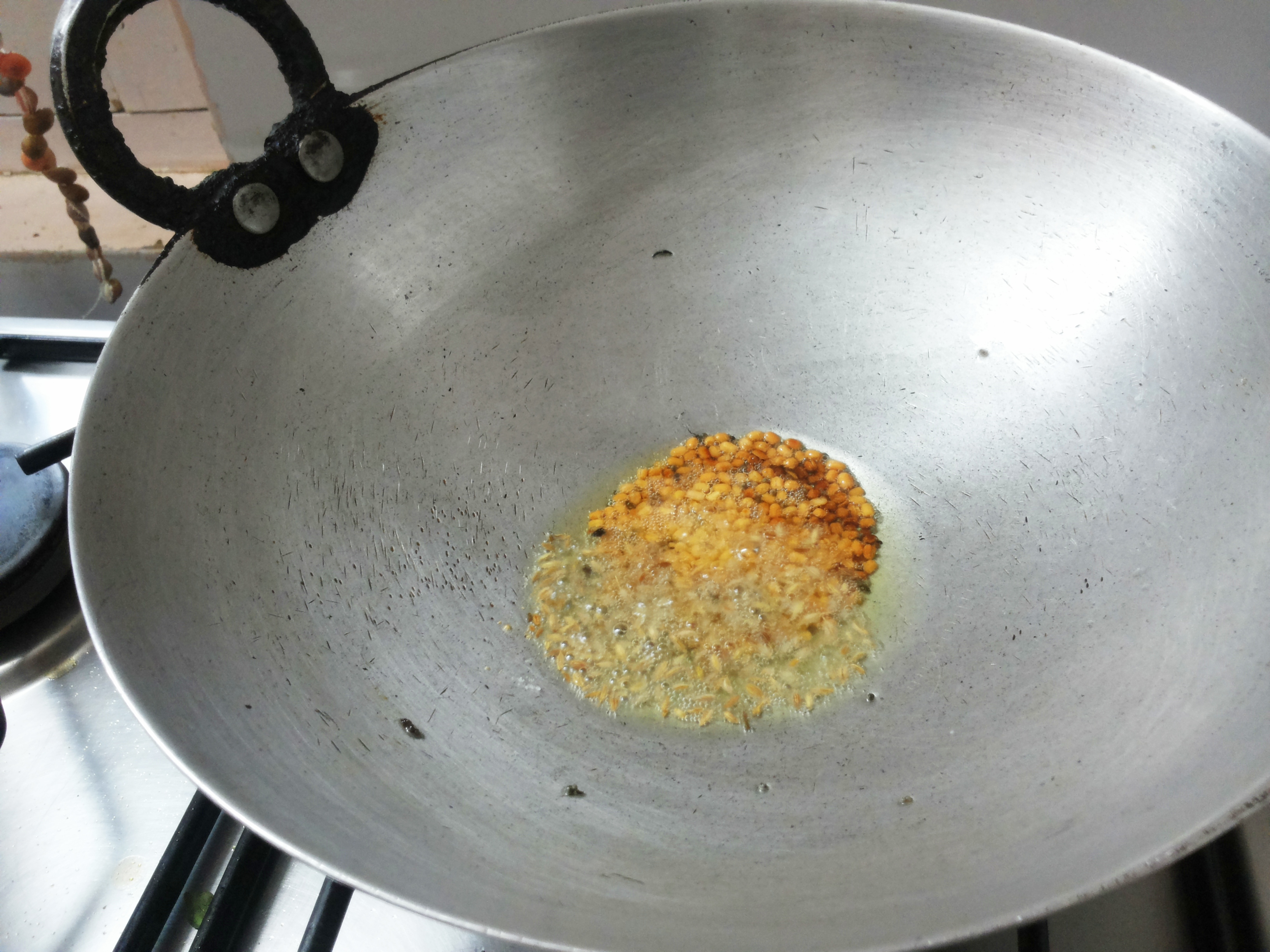 add mustard seeds, and split black gram