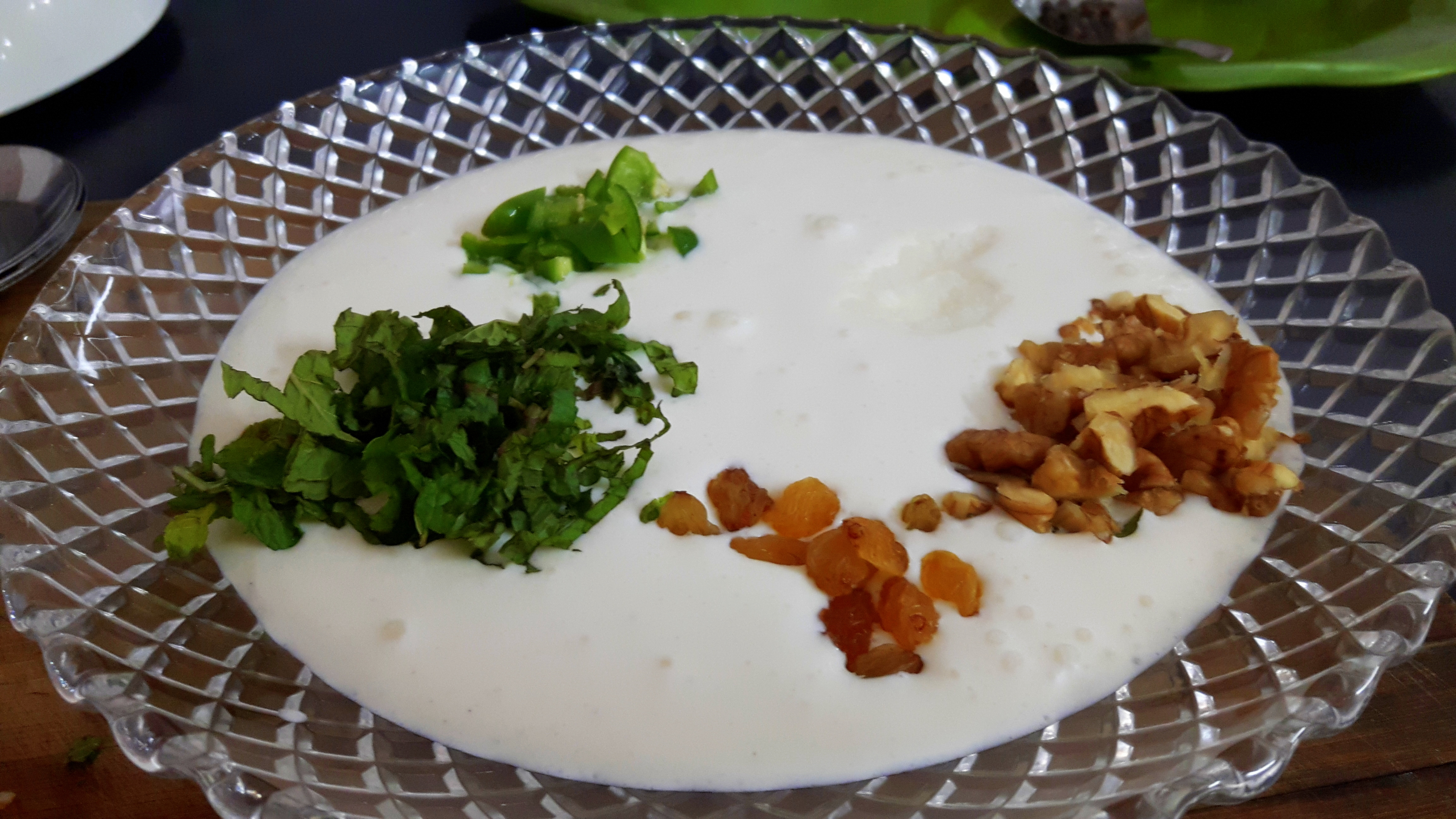 Add walnut, dry grapes, pomegranate areal and mint leaves