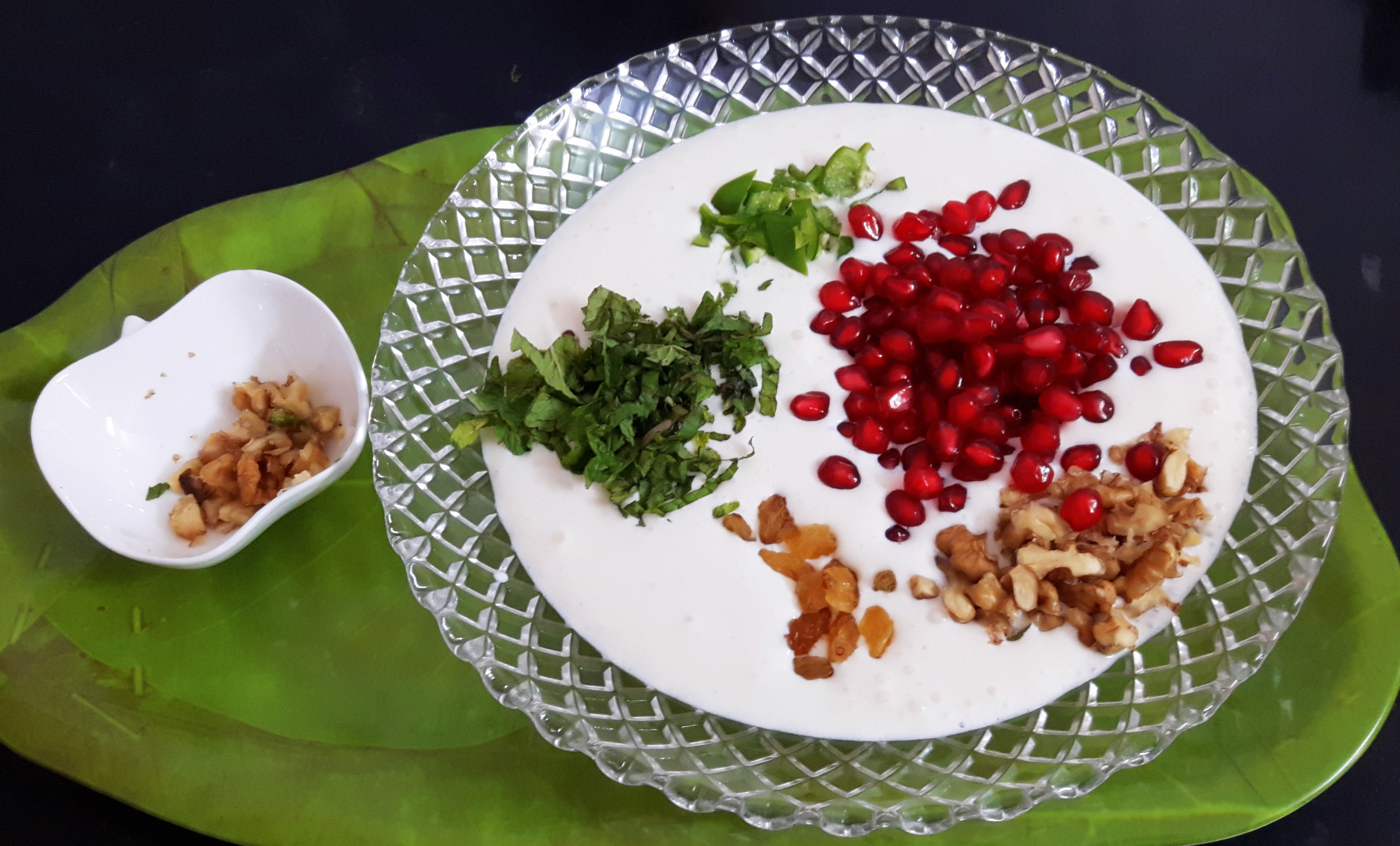 Add walnut, dry grapes, pomegranate areal and mint leaves