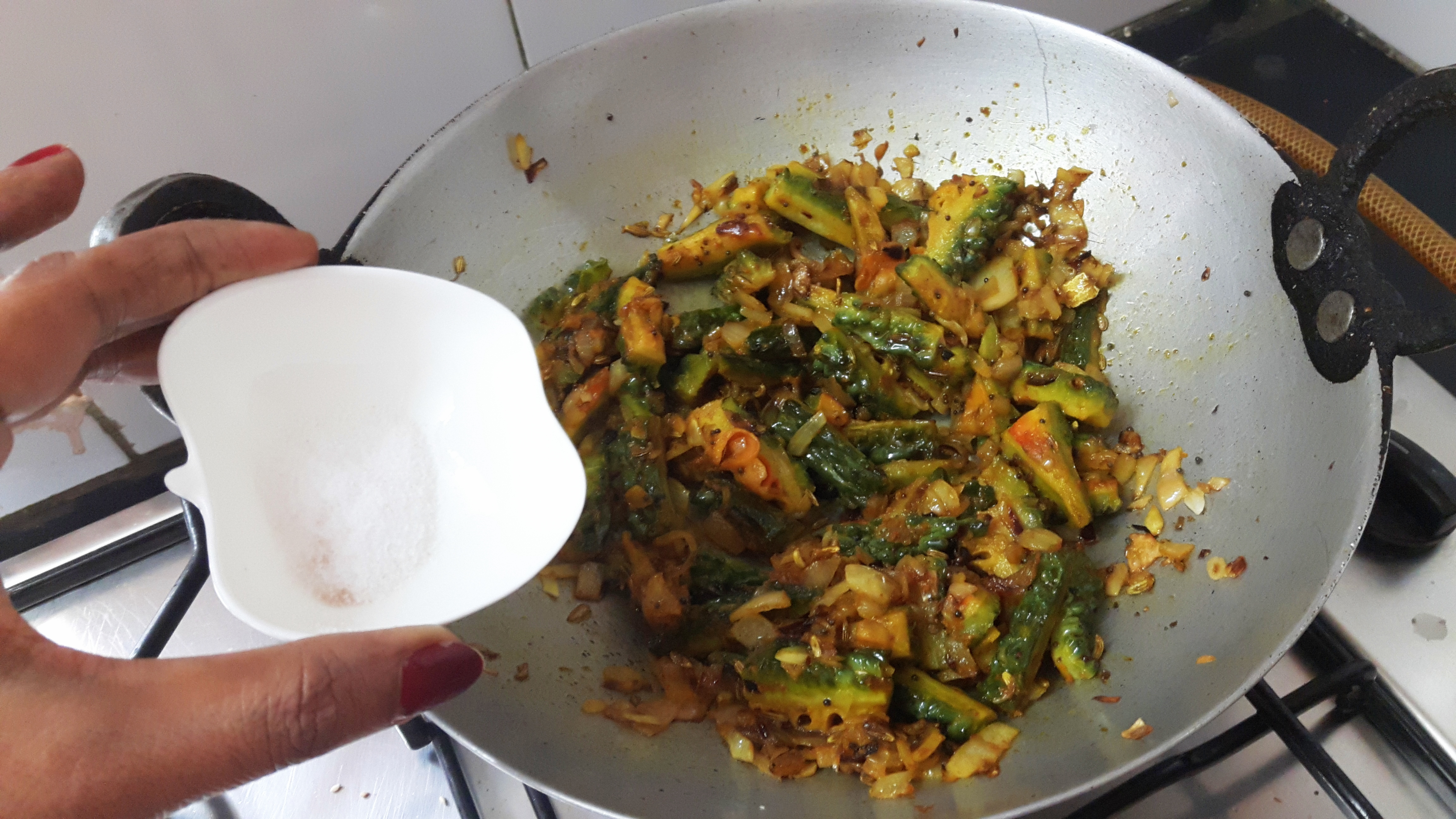 add coriander powder, turmeric powder, salt, peanut, and sesame seed powder