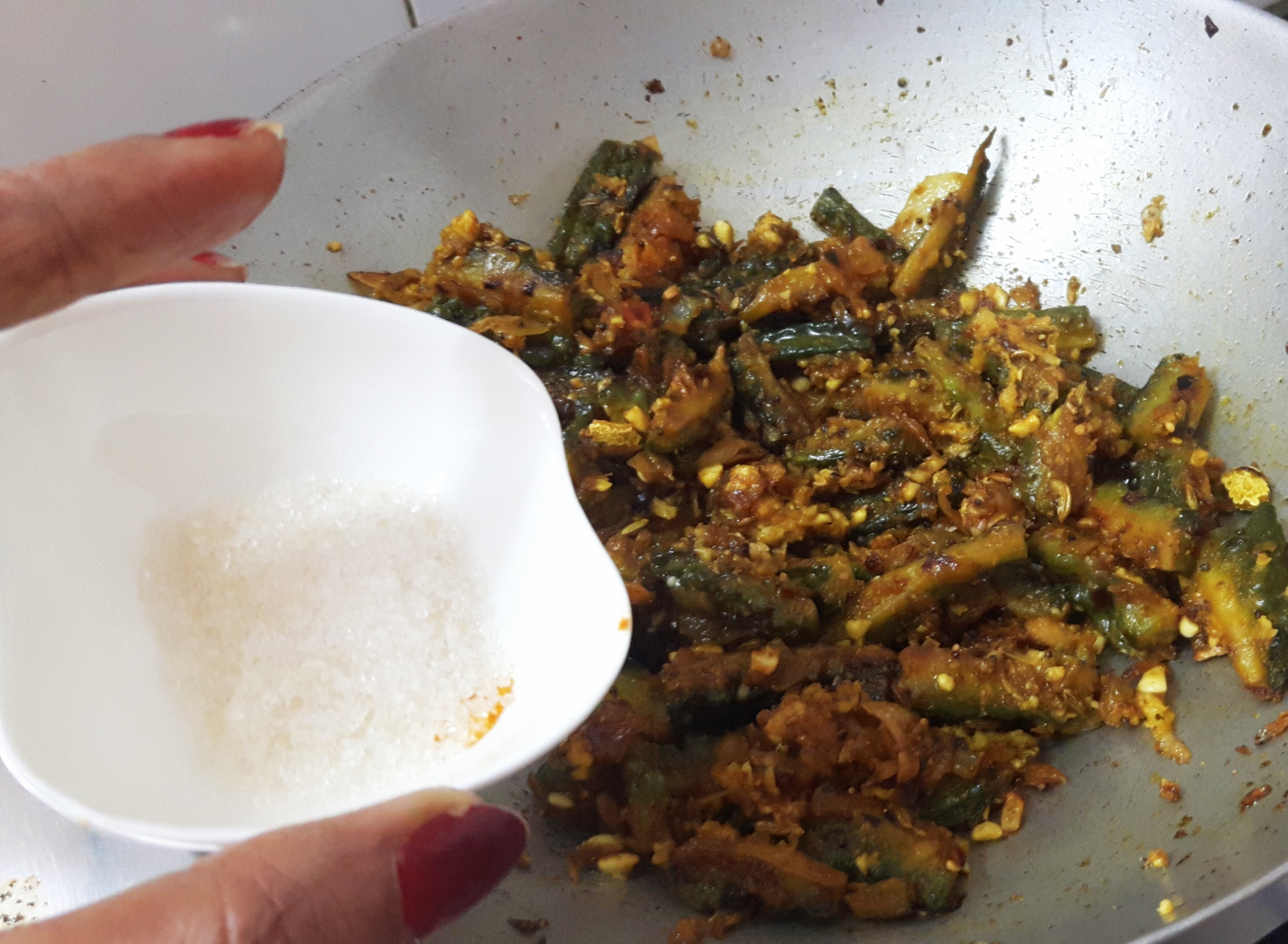 Add scrapped fresh coconut and sugar