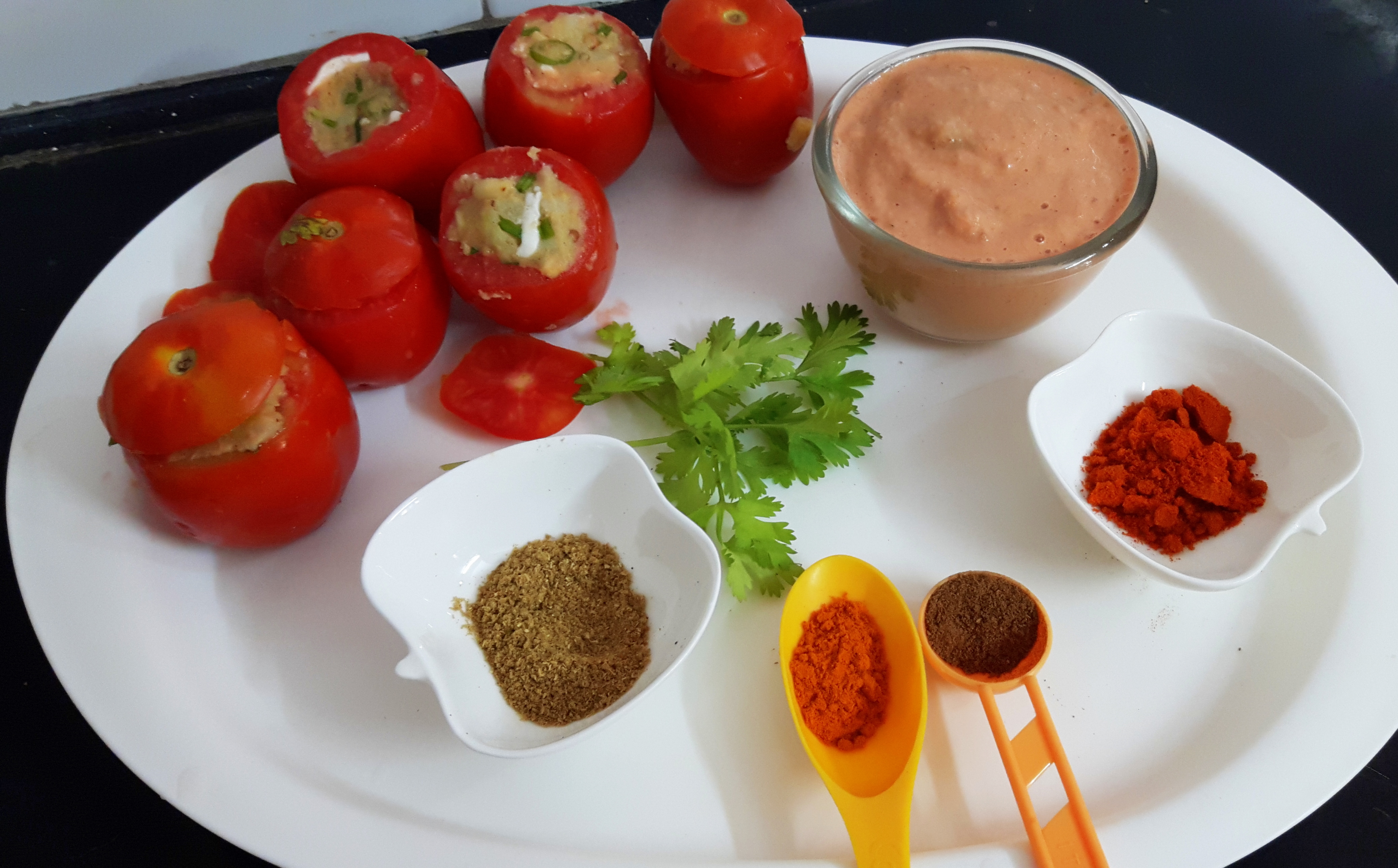 , cover them with stem side tomato pieces and fix them with help of tooth pick.