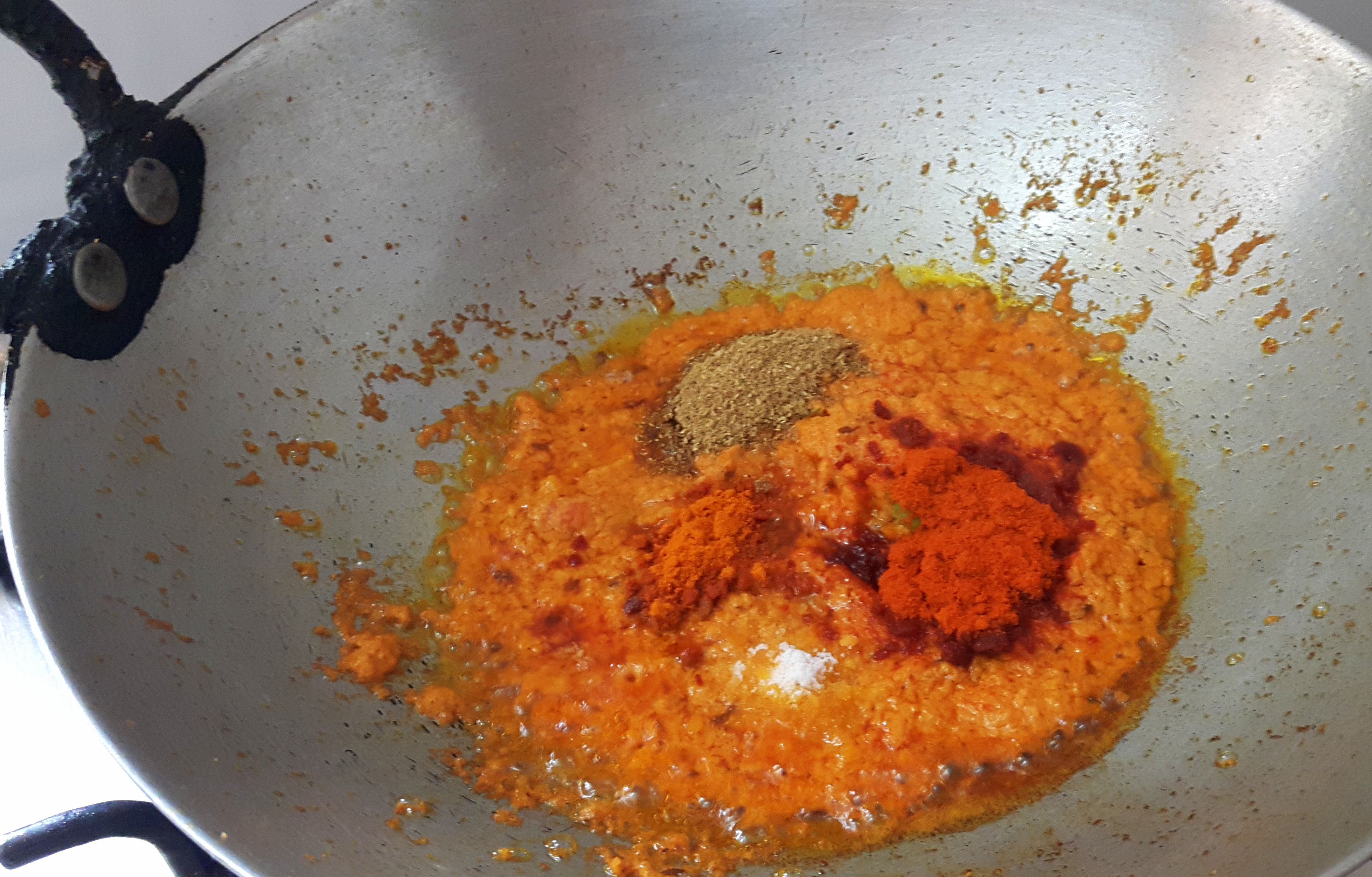 add salt, turmeric powder, chili powder, and coriander powder