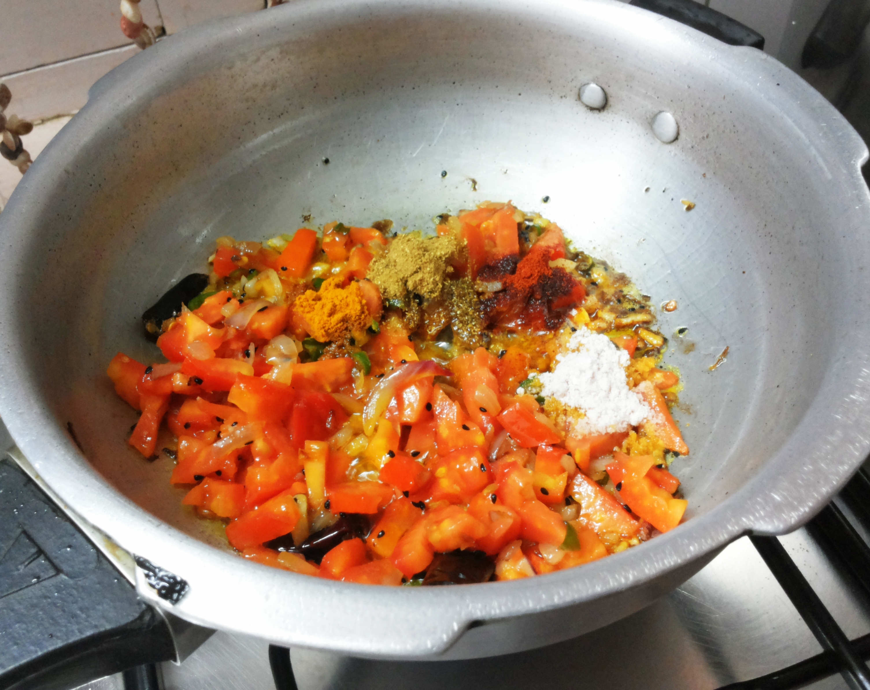 add chili powder, salt and turmeric powder and coriander powder