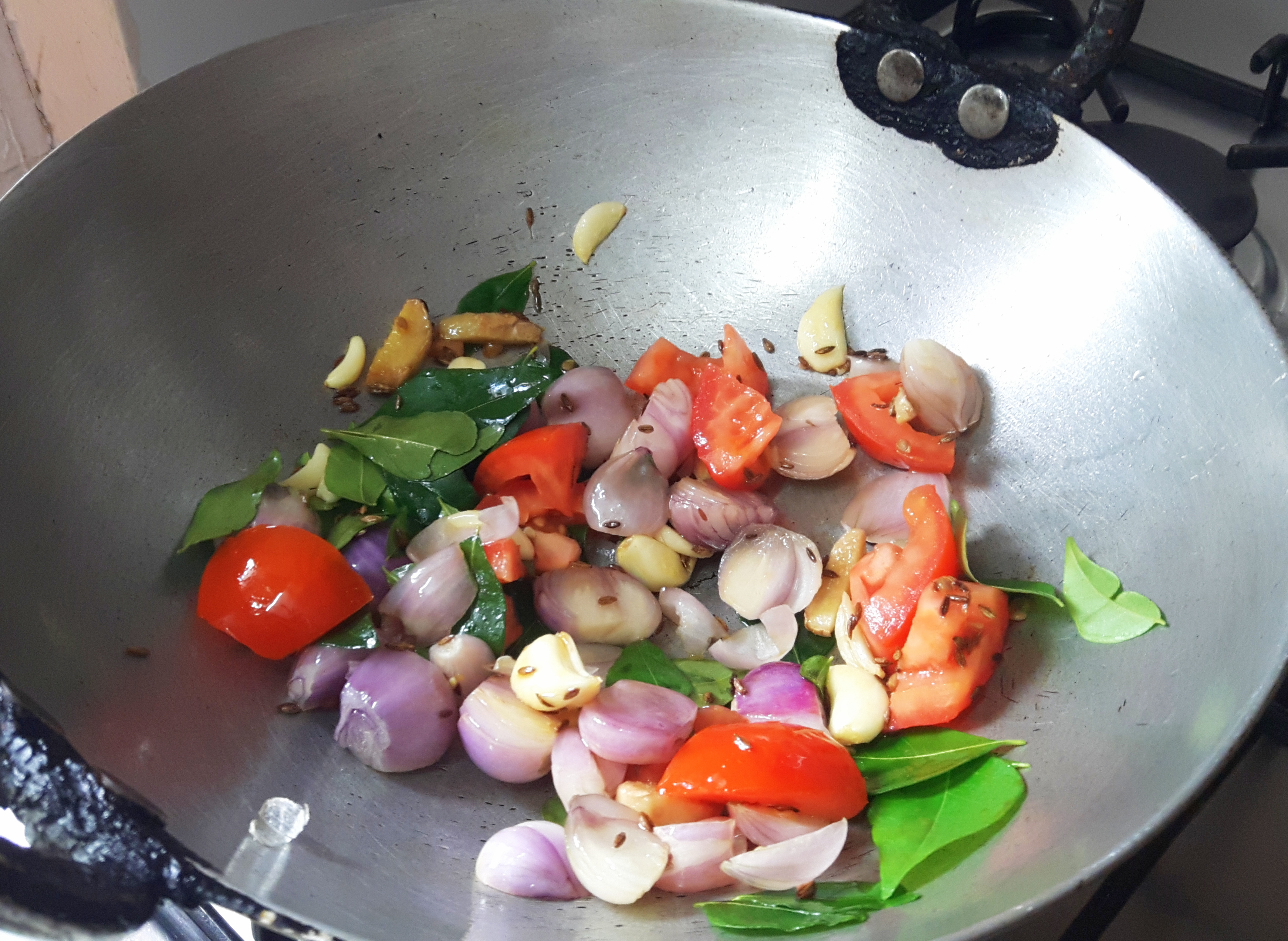 add ginger, garlic, onion, tomato , and curry leaves