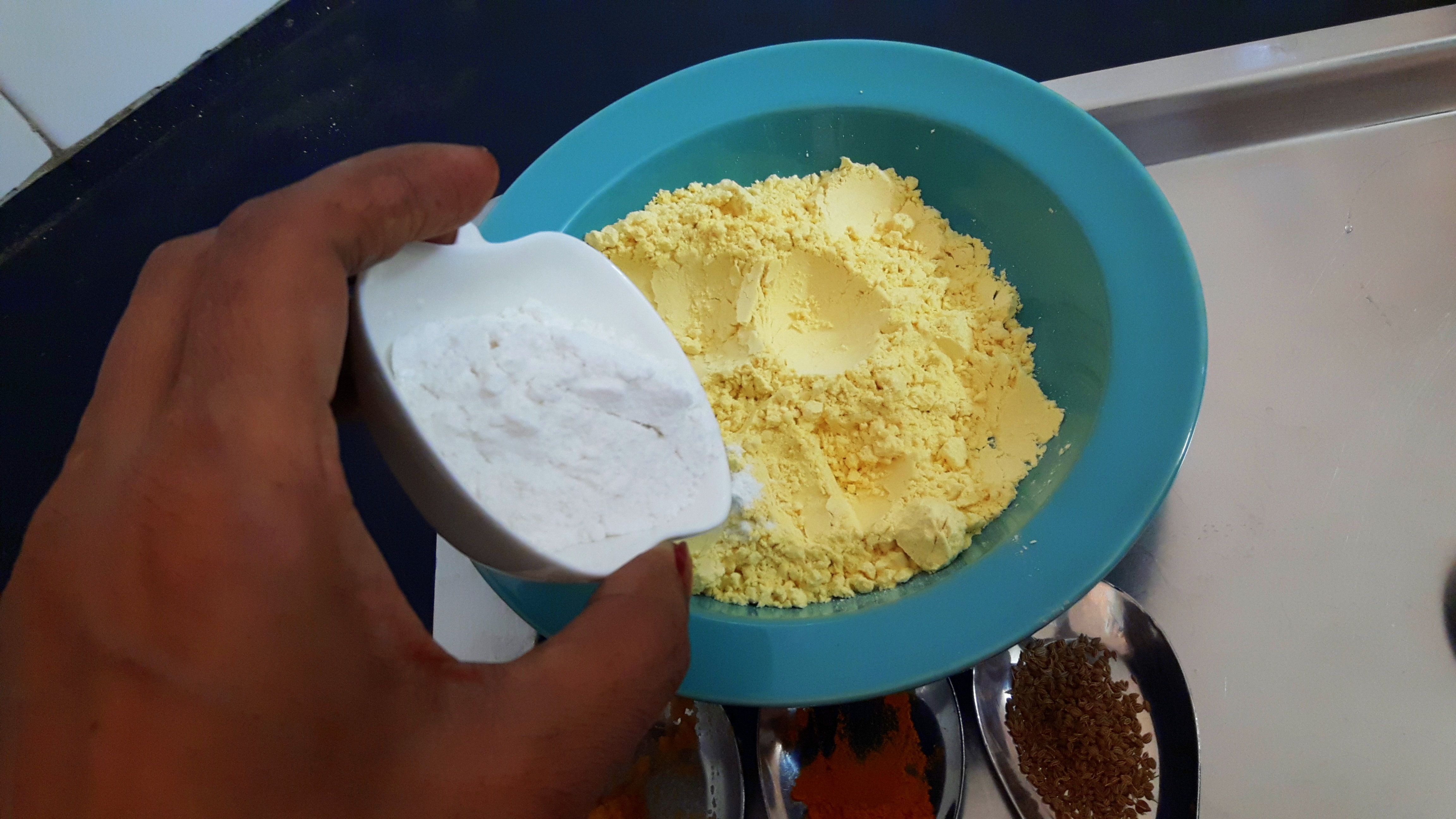 Put Besan, rice flour, salt, chili powder