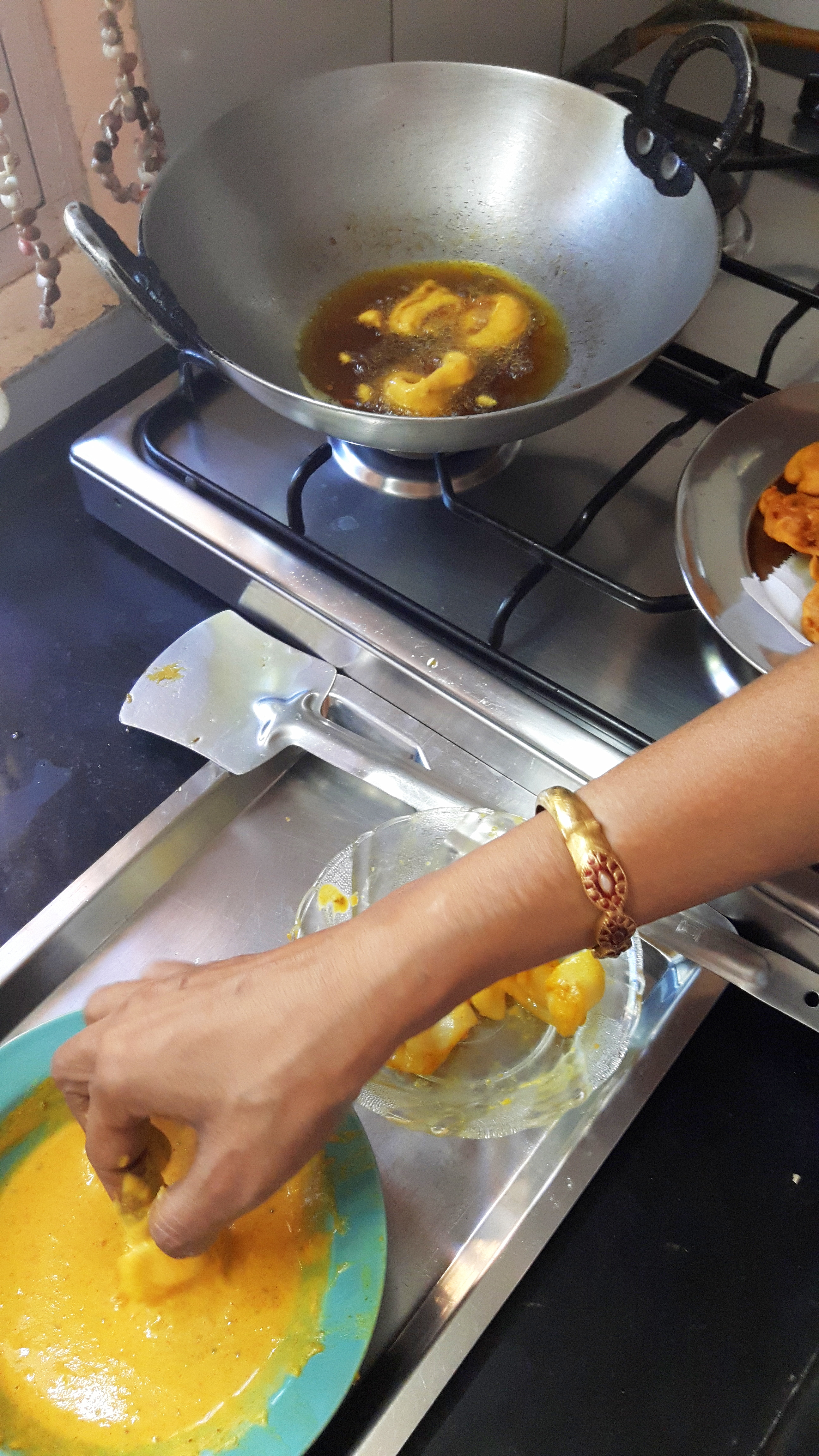 dip the squid ring into batter