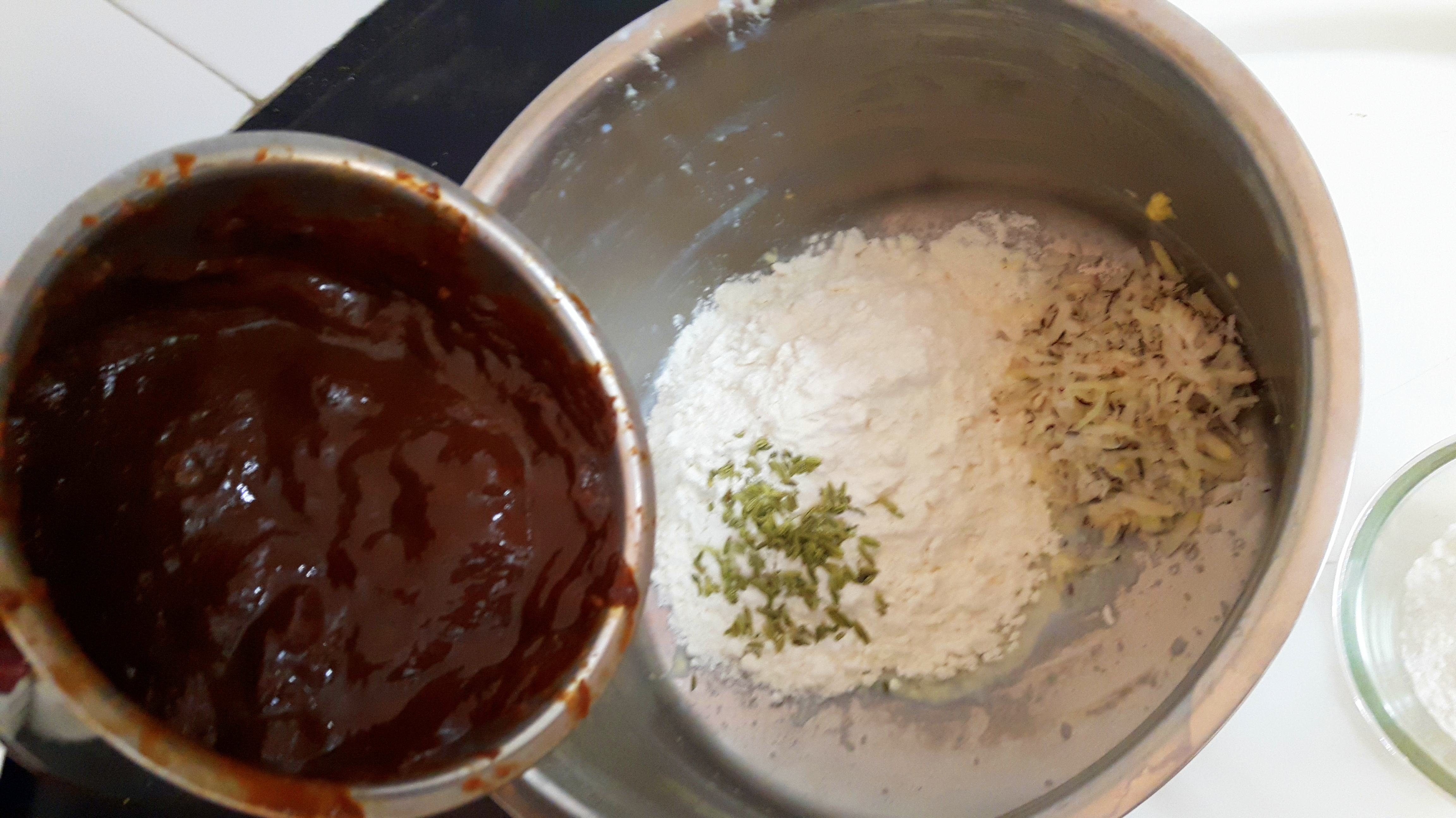 Put Maida, Sooji, together in a big mixing bowl and make smooth batter