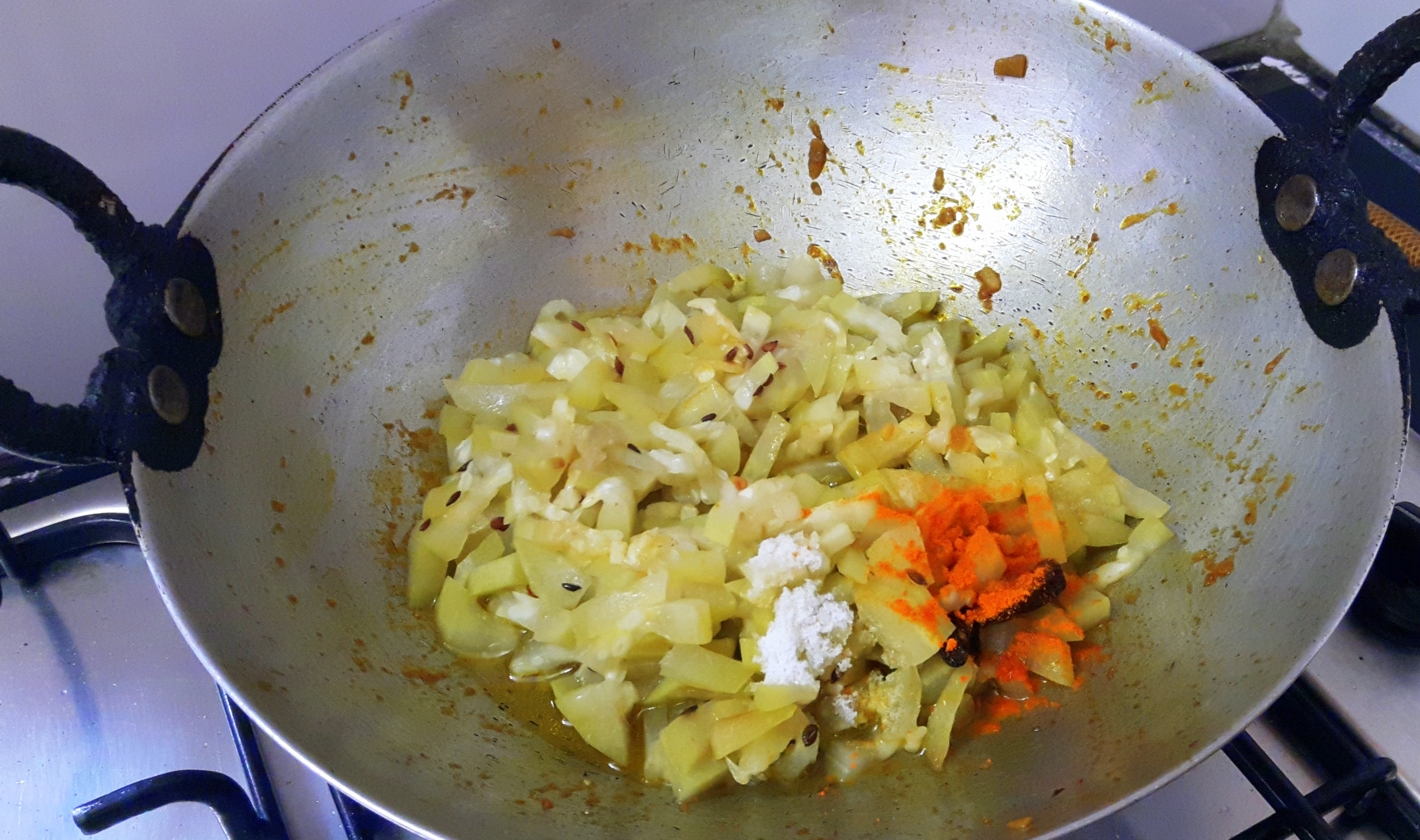 add turmeric powder and salt