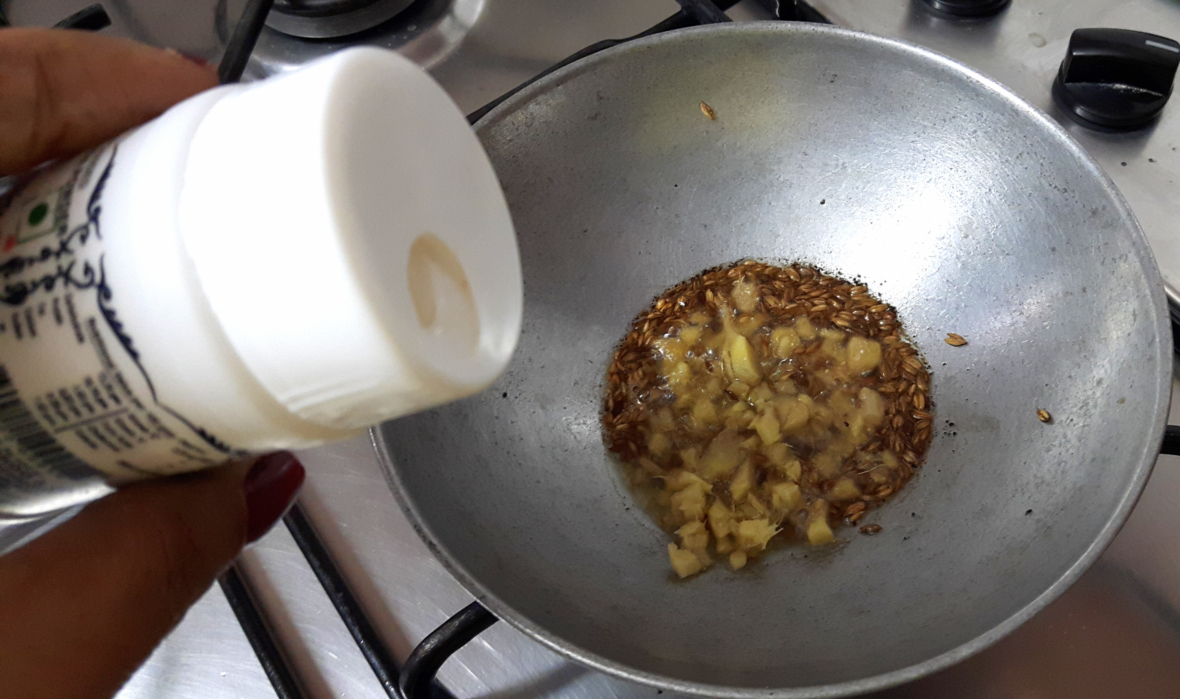 add chopped ginger, asafoetida