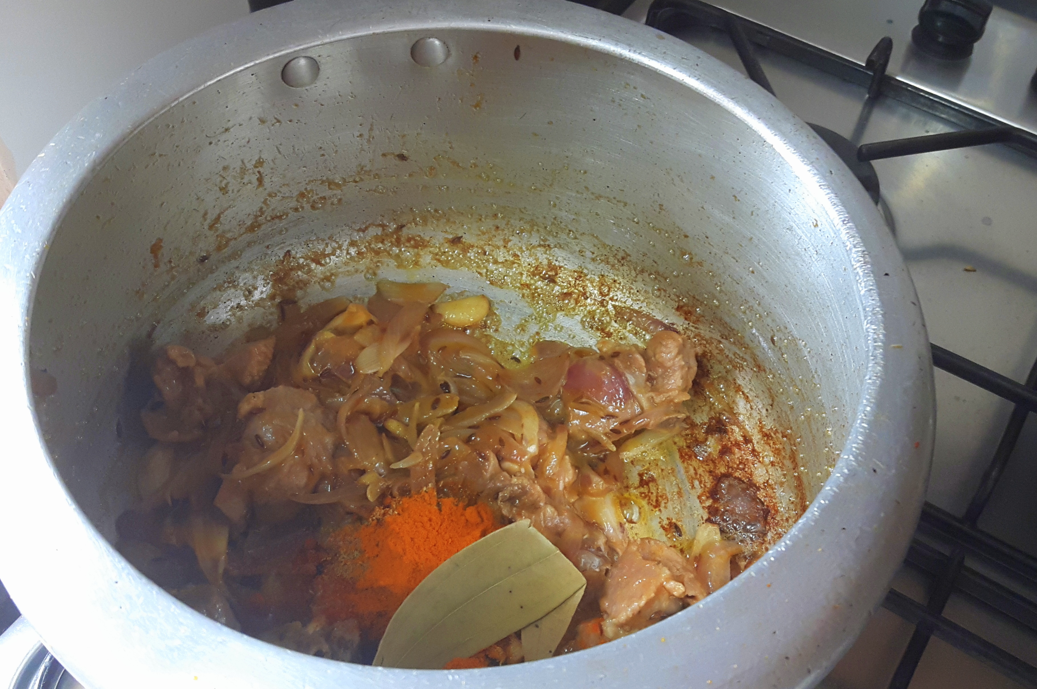 Add salt, chili powder, coriander powder, turmeric powder