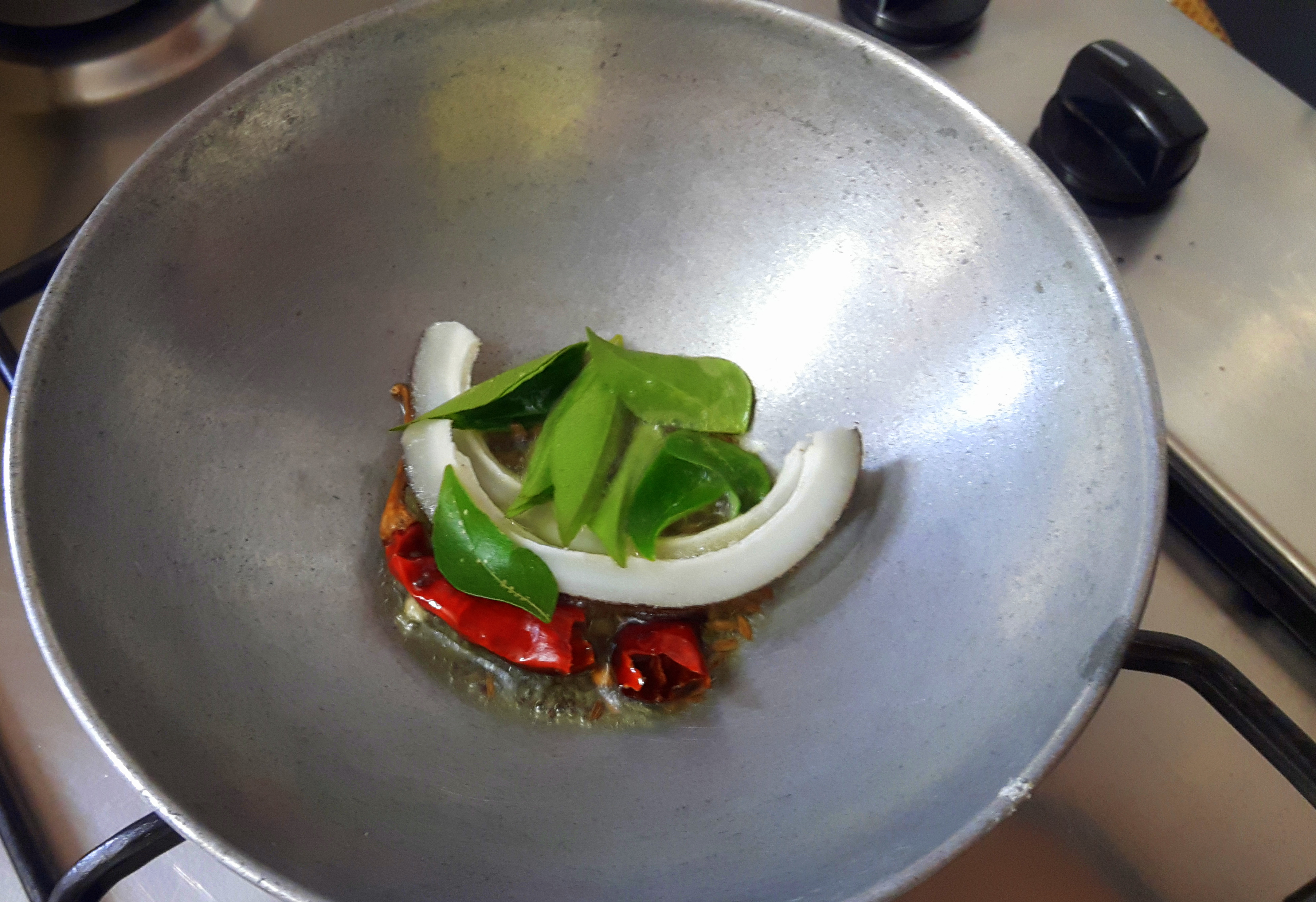 Add asafetida and curry leaves