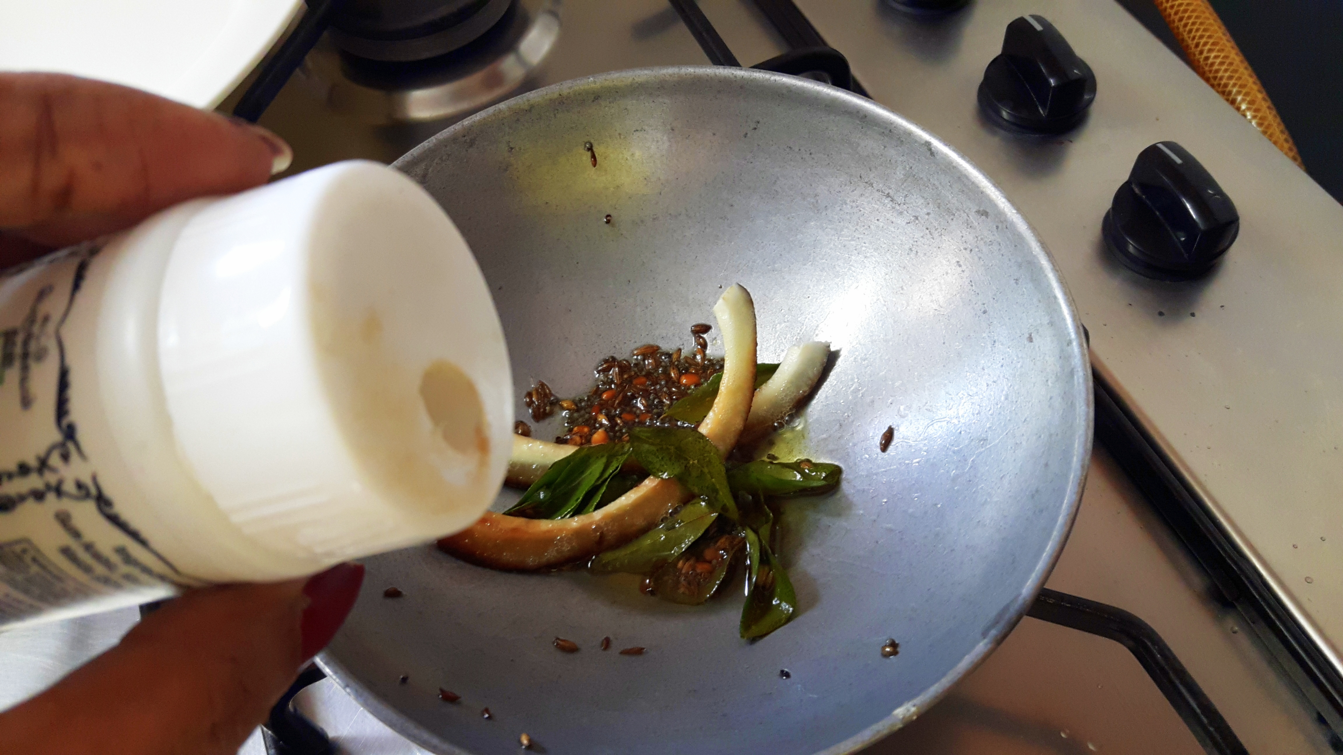 Add asafetida and curry leaves