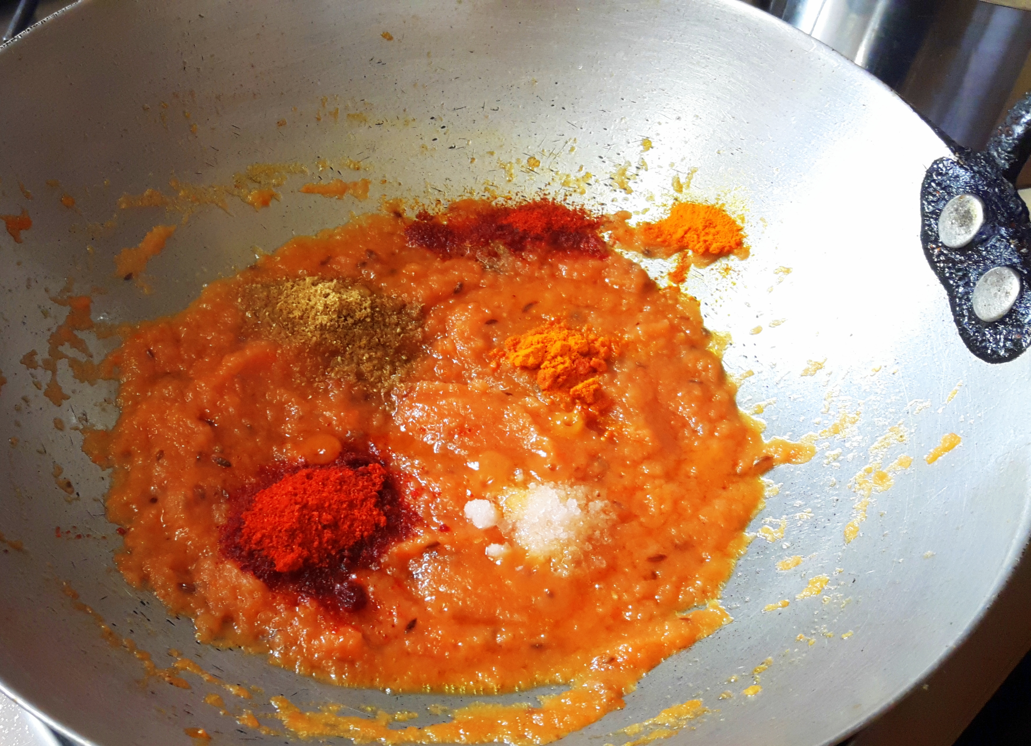 add salt, turmeric powder, chili powder, and coriander powder