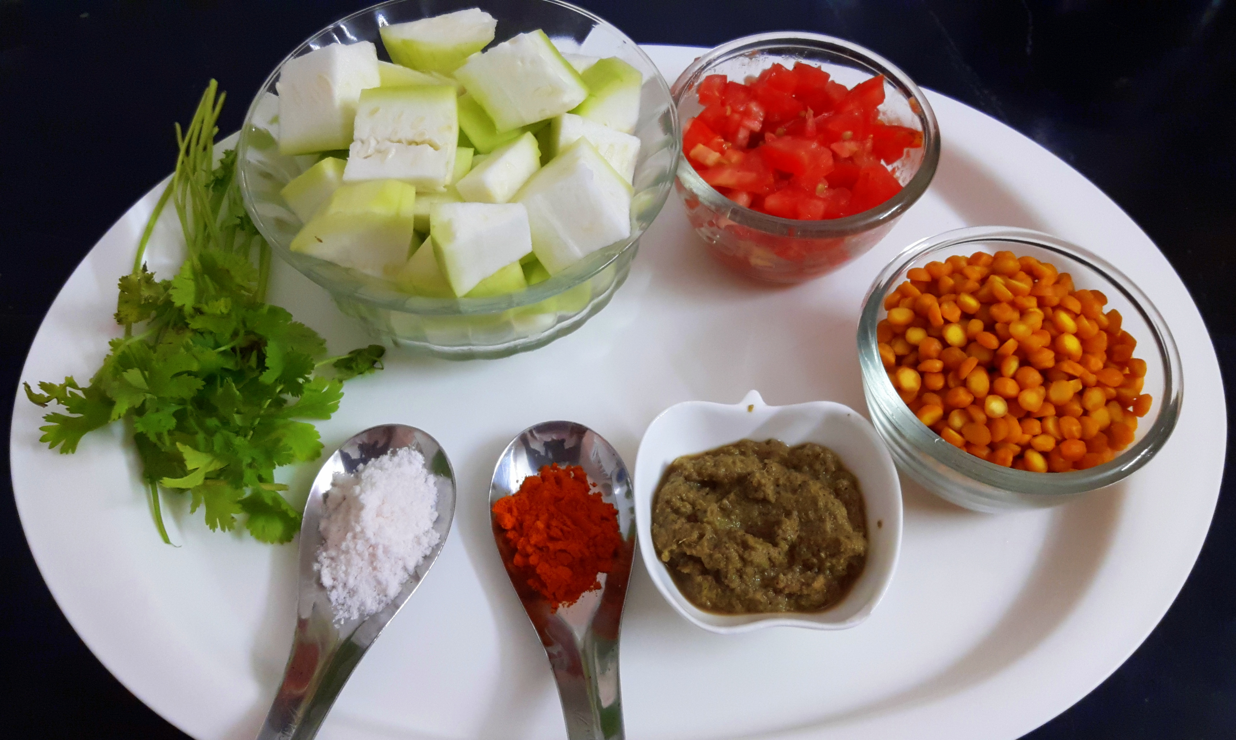 Peel and chop lauki into cubes