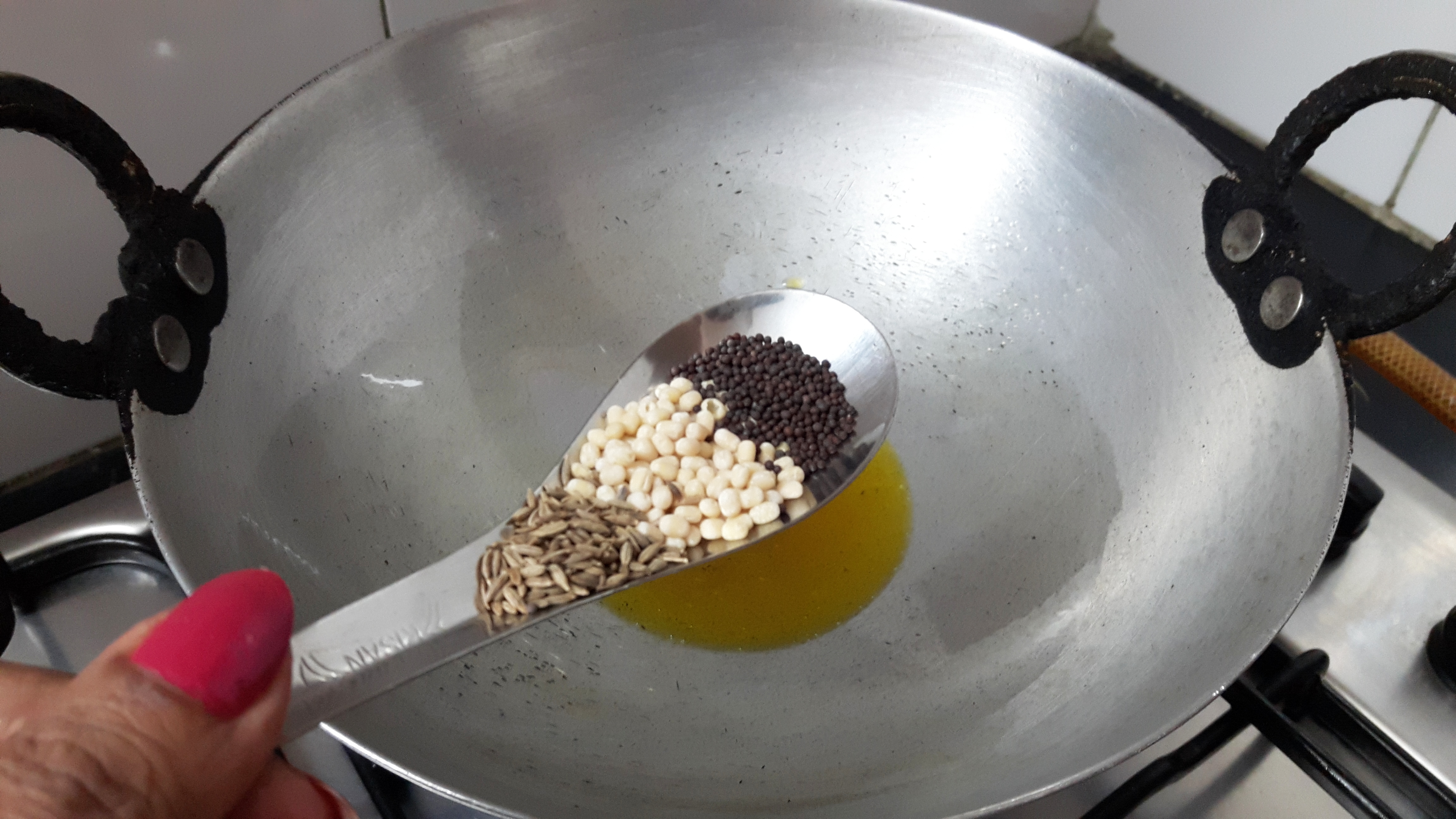 add cumin, split black gram and mustard seed