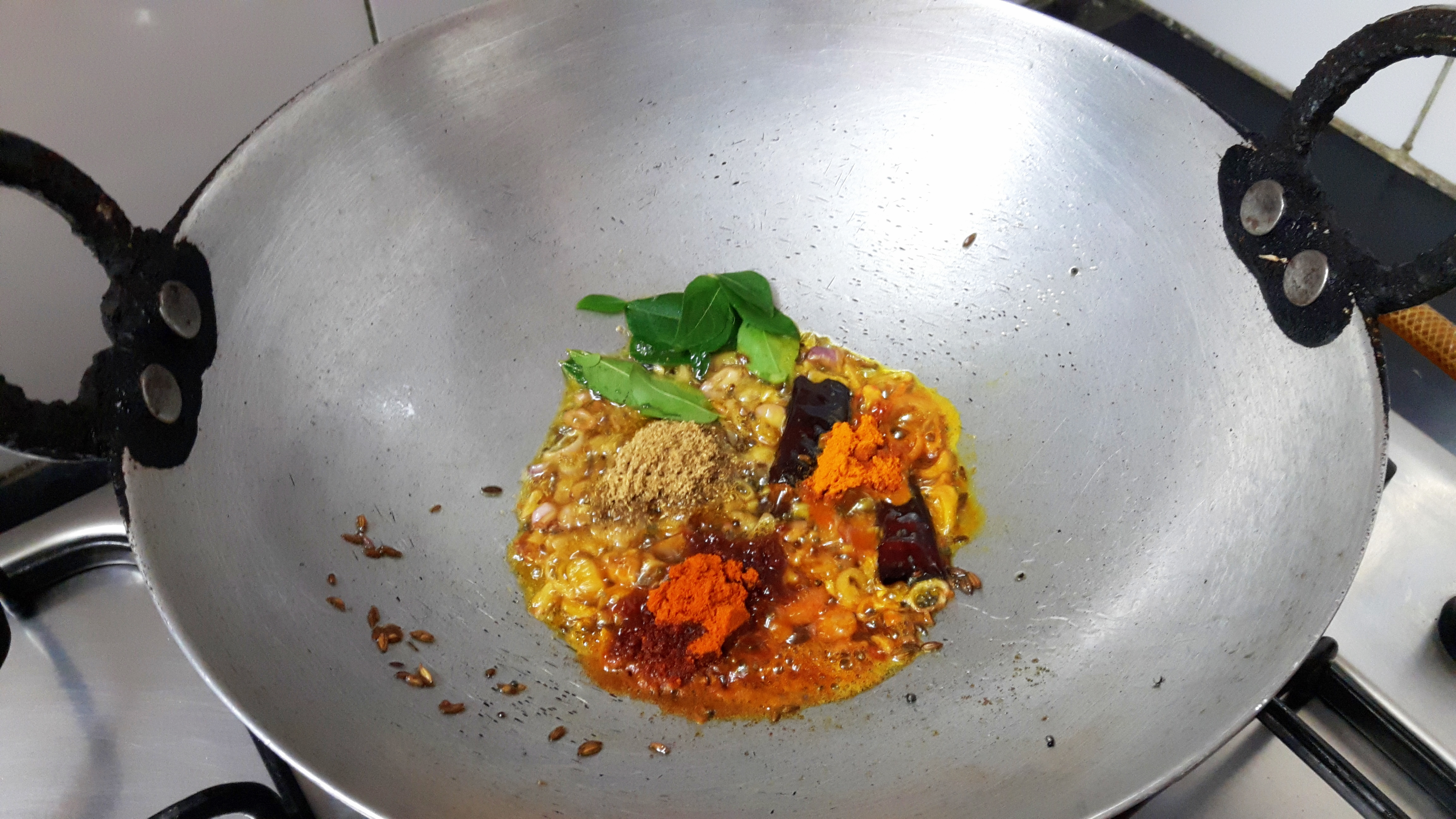 Add coriander powder, turmeric powder, chili powder and salt