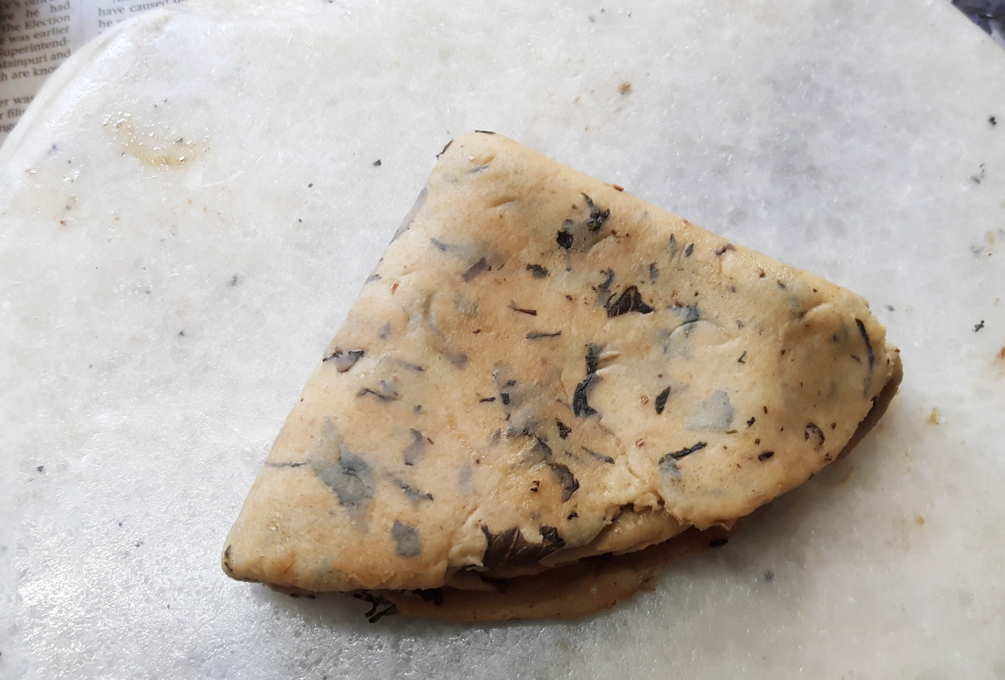 roll it evenly into triangle paratha