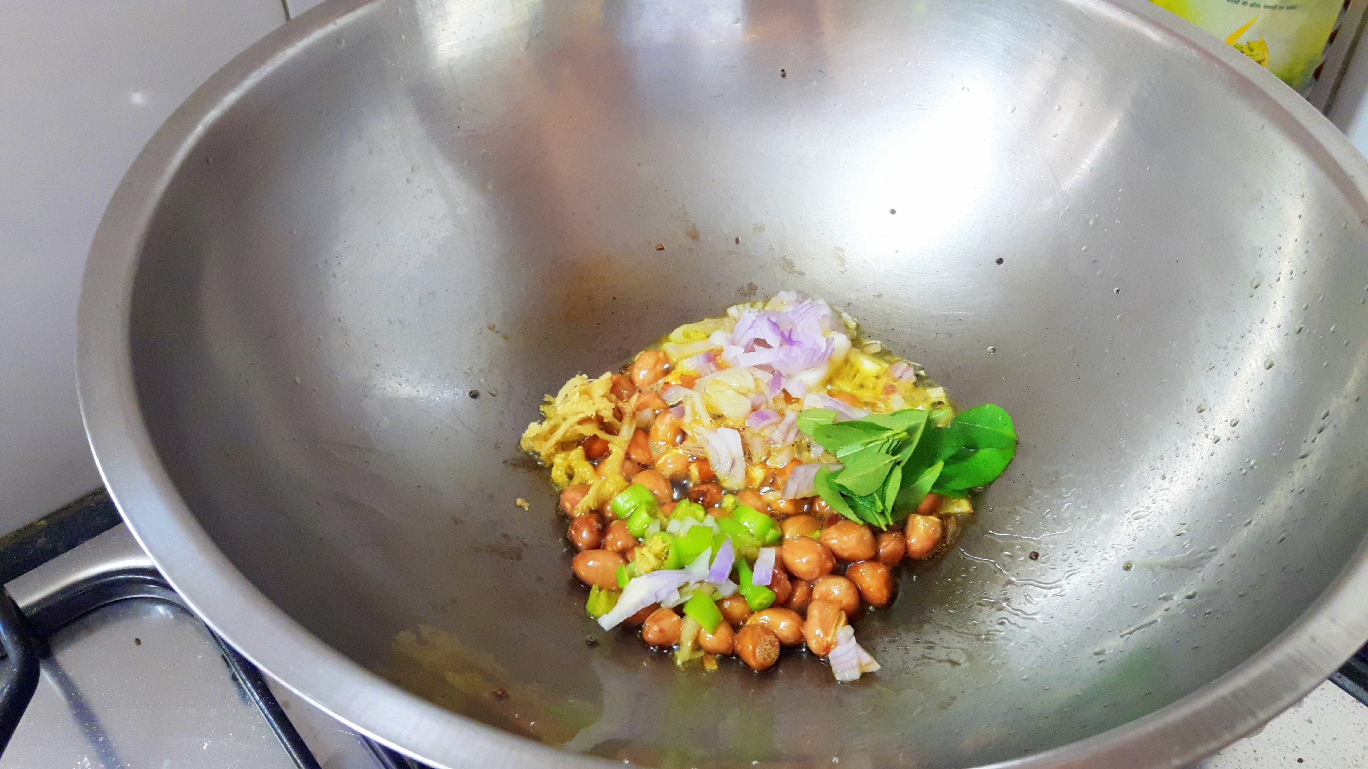 put chopped onion, chili, curry leaves and ginger