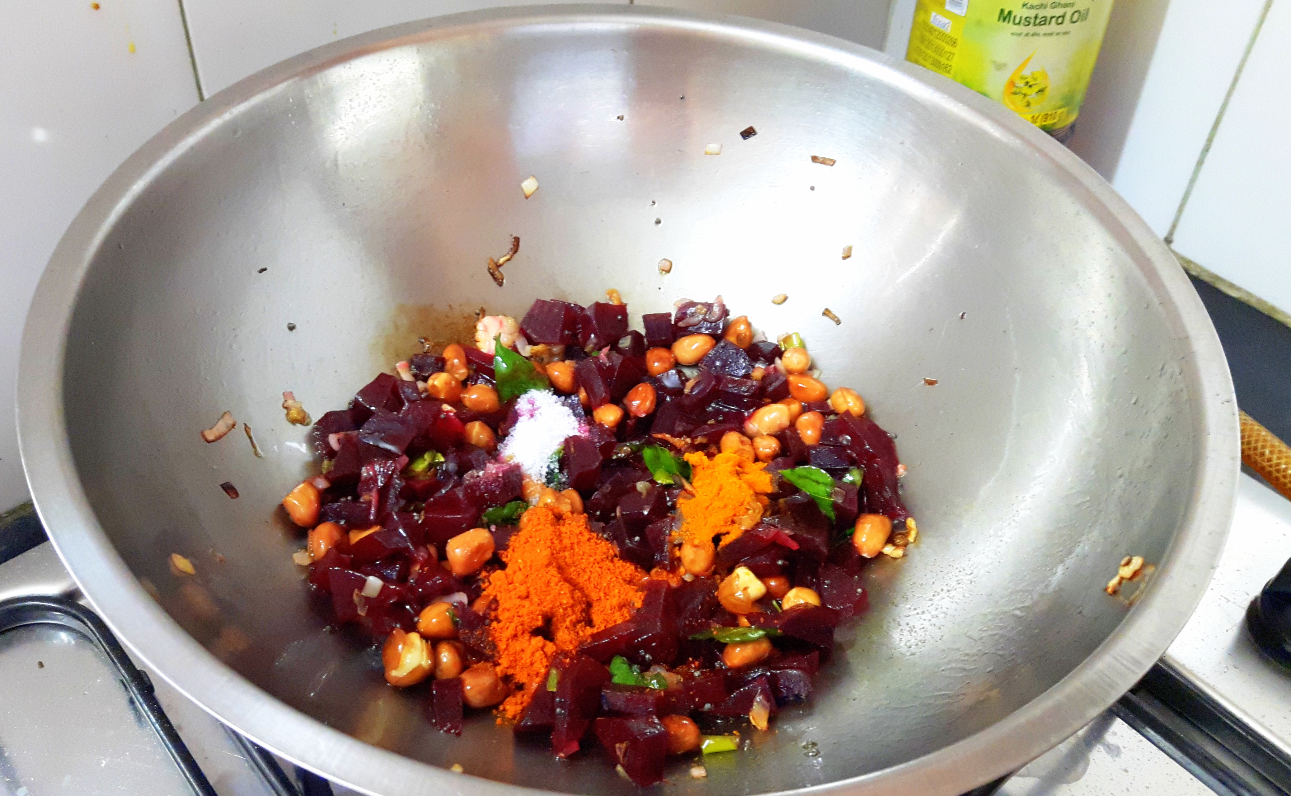 add turmeric powder, chili powder and salt