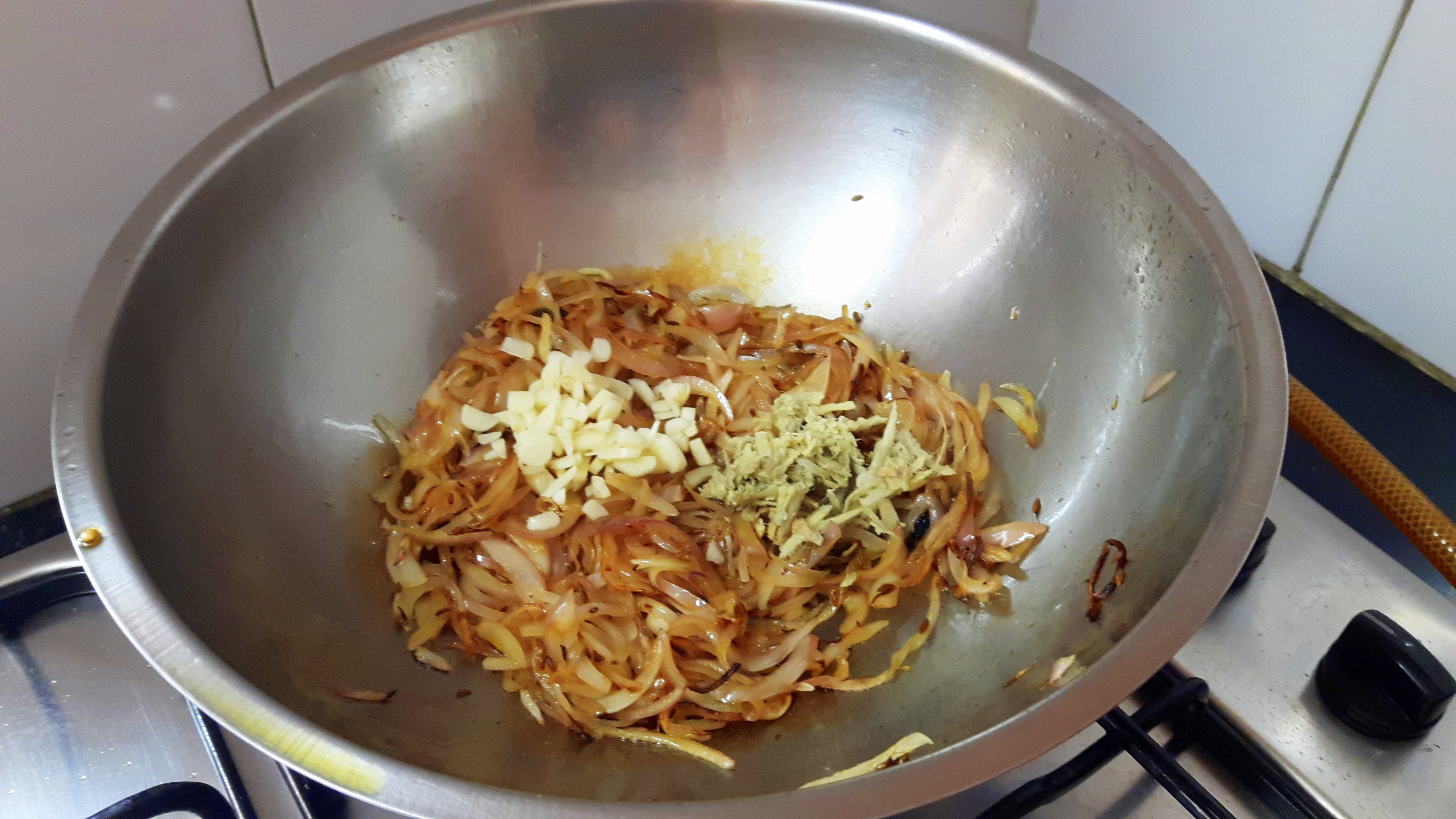 add ginger garlic and sliced tomato