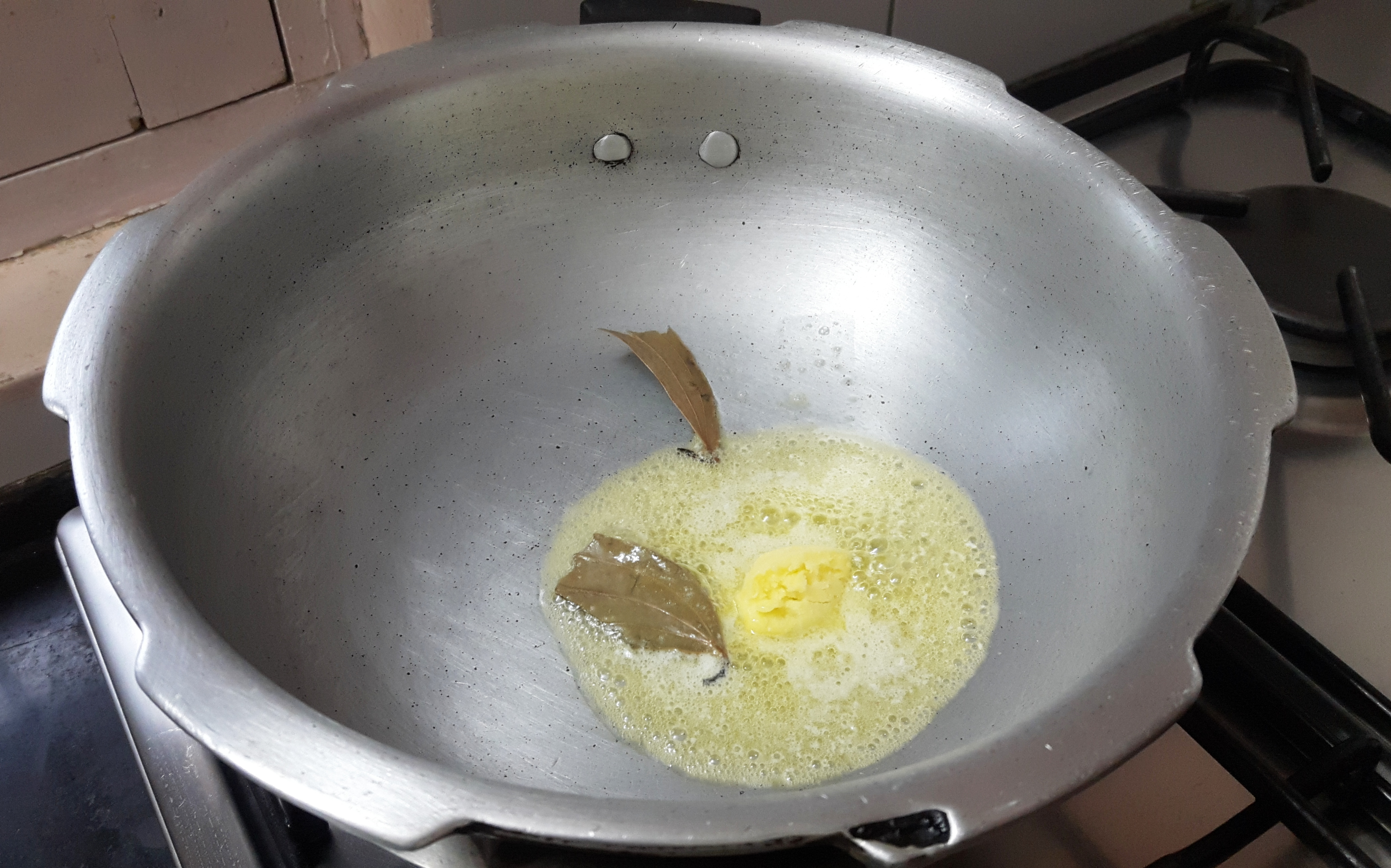 put butter and bay leaf