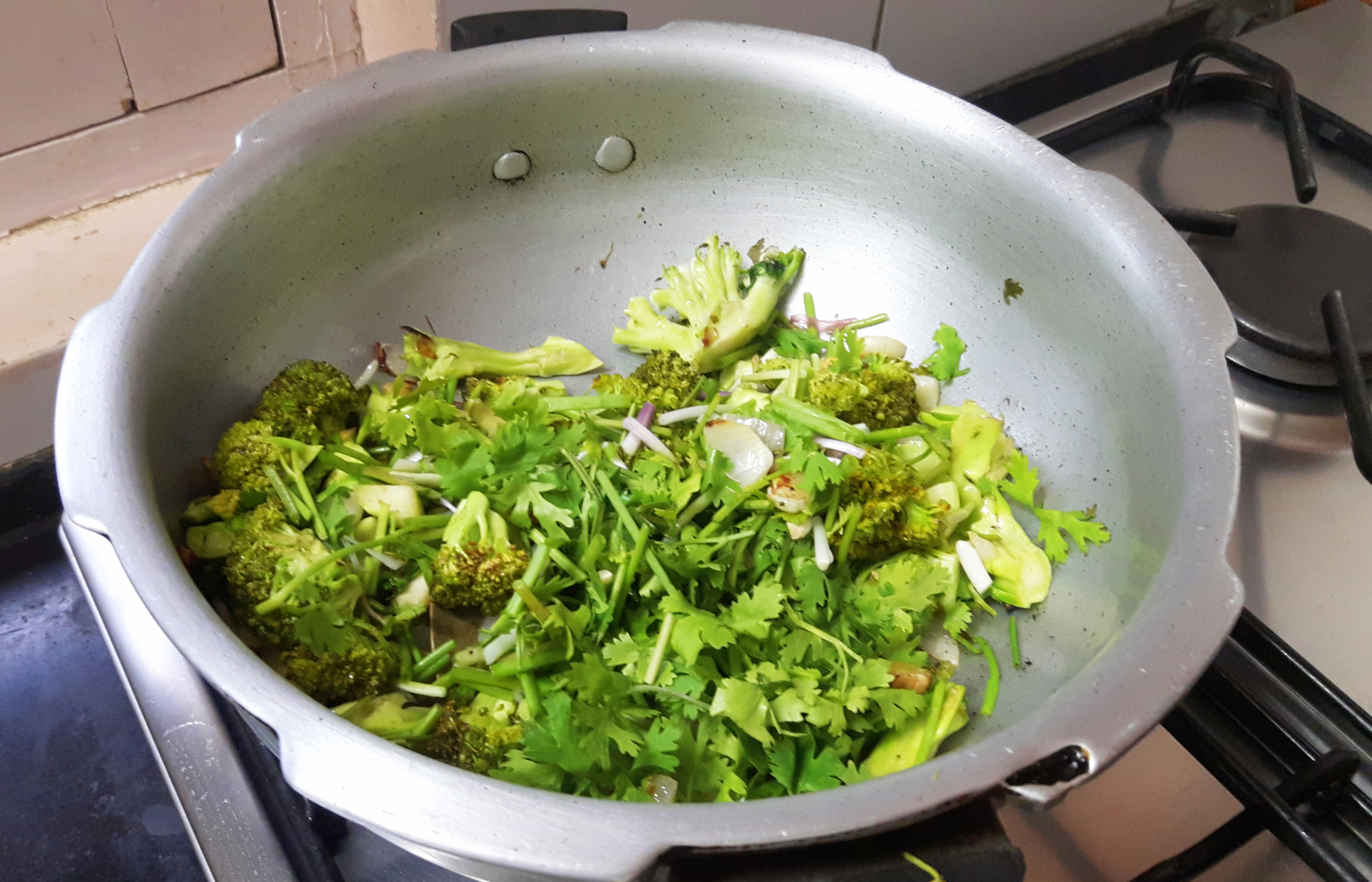 add spring onion and green coriander leaves