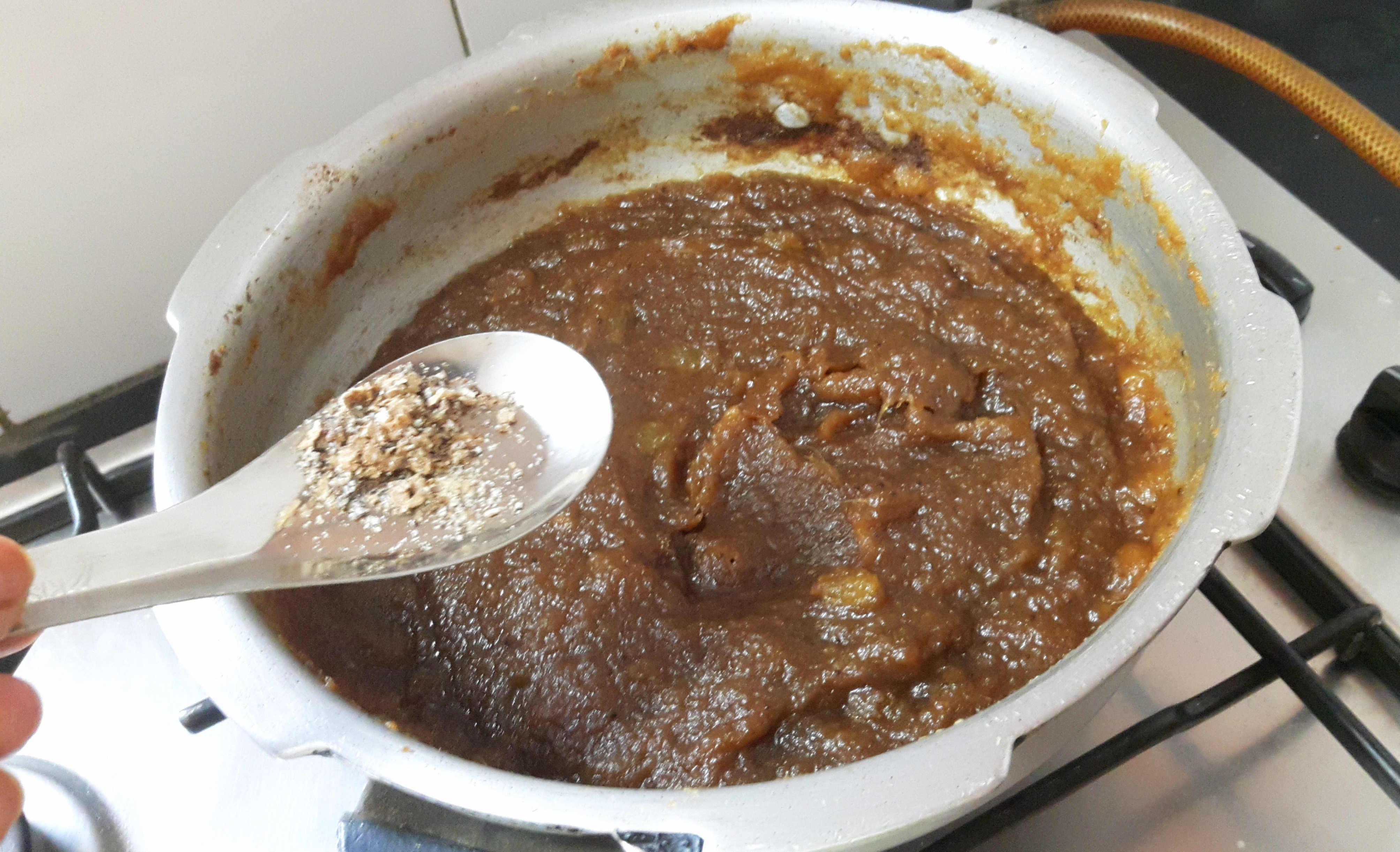 Add dry grapes and cardamom power