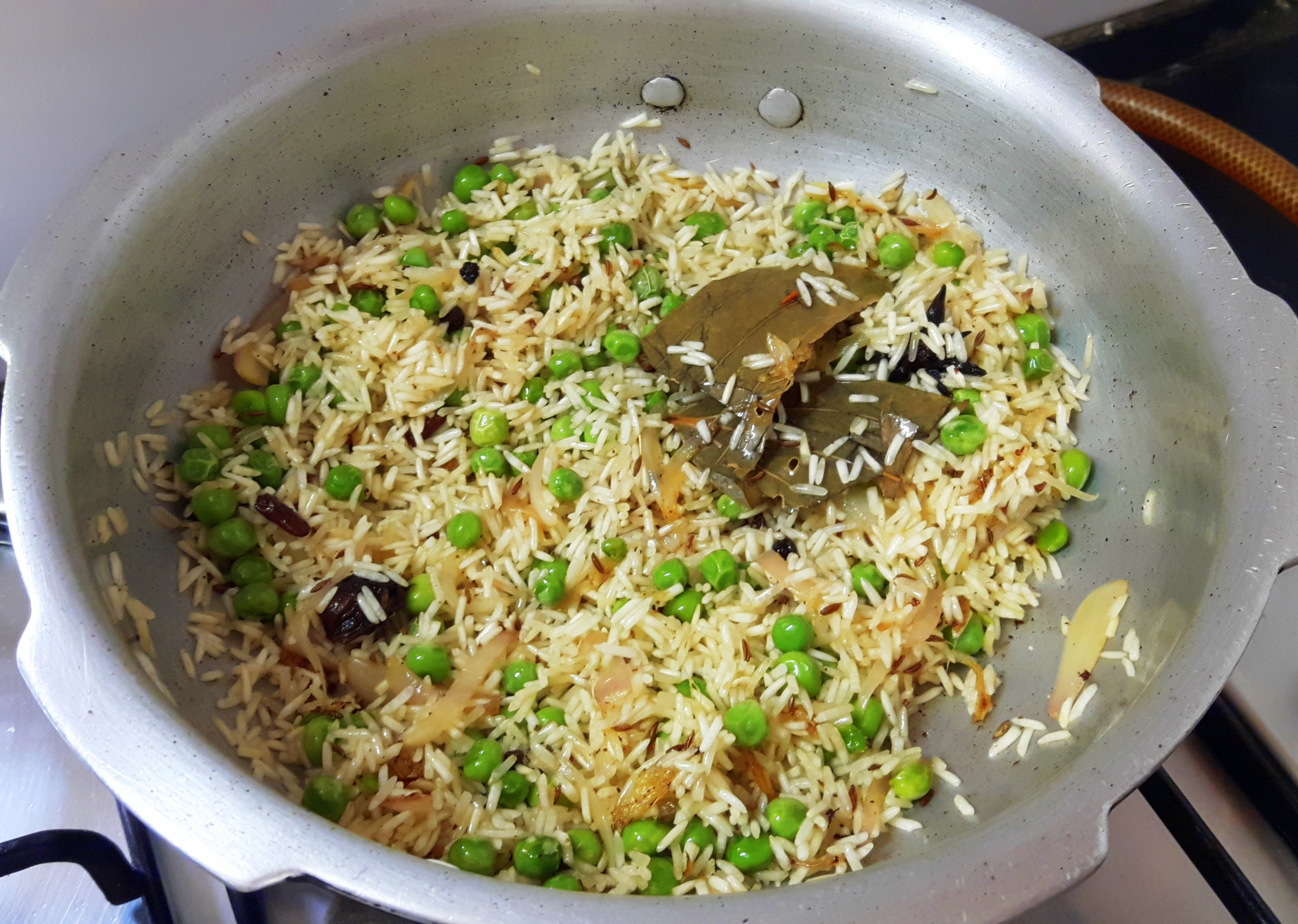 add washed rice and fry