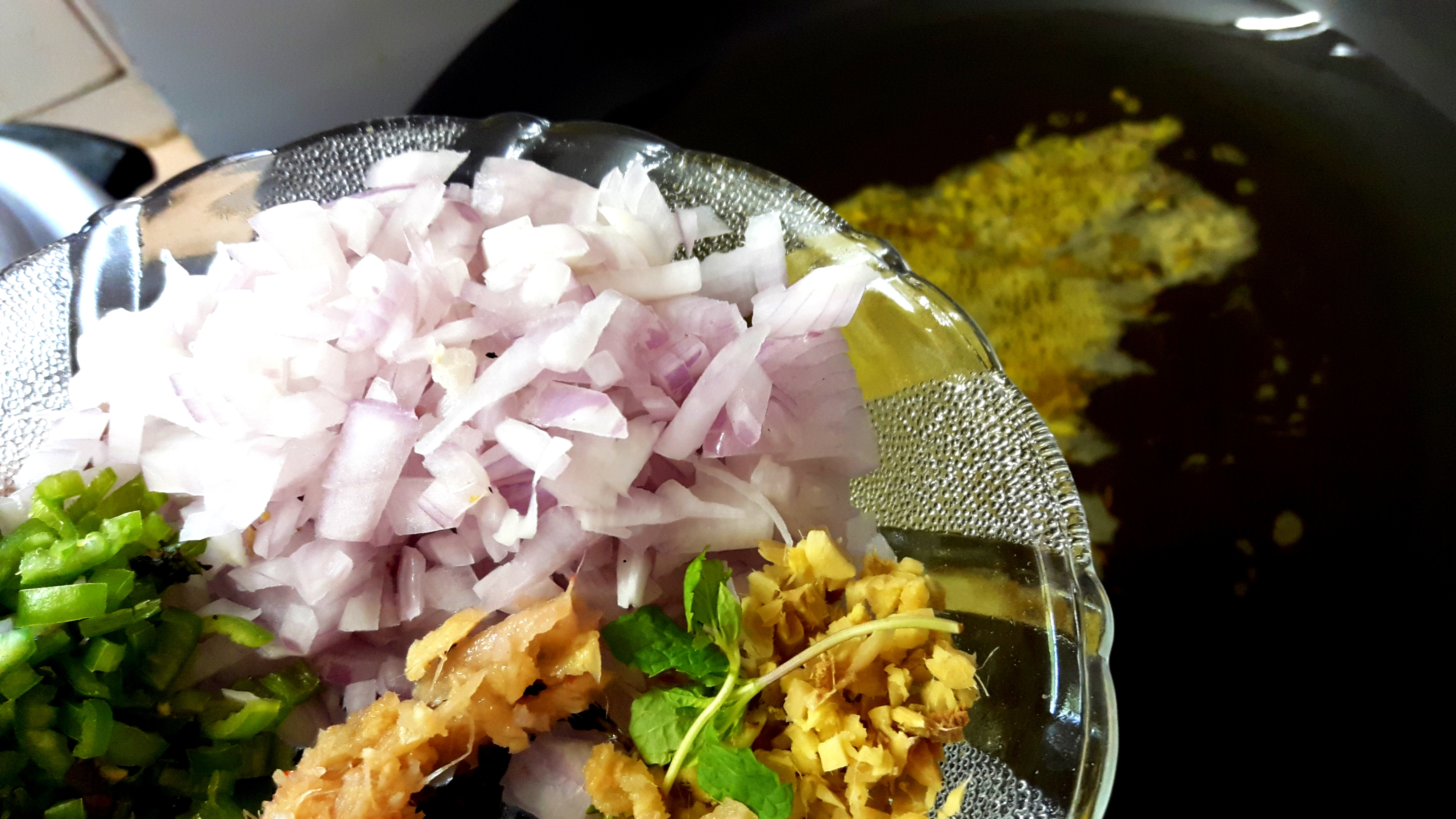 add chopped green chili, ginger and onion.