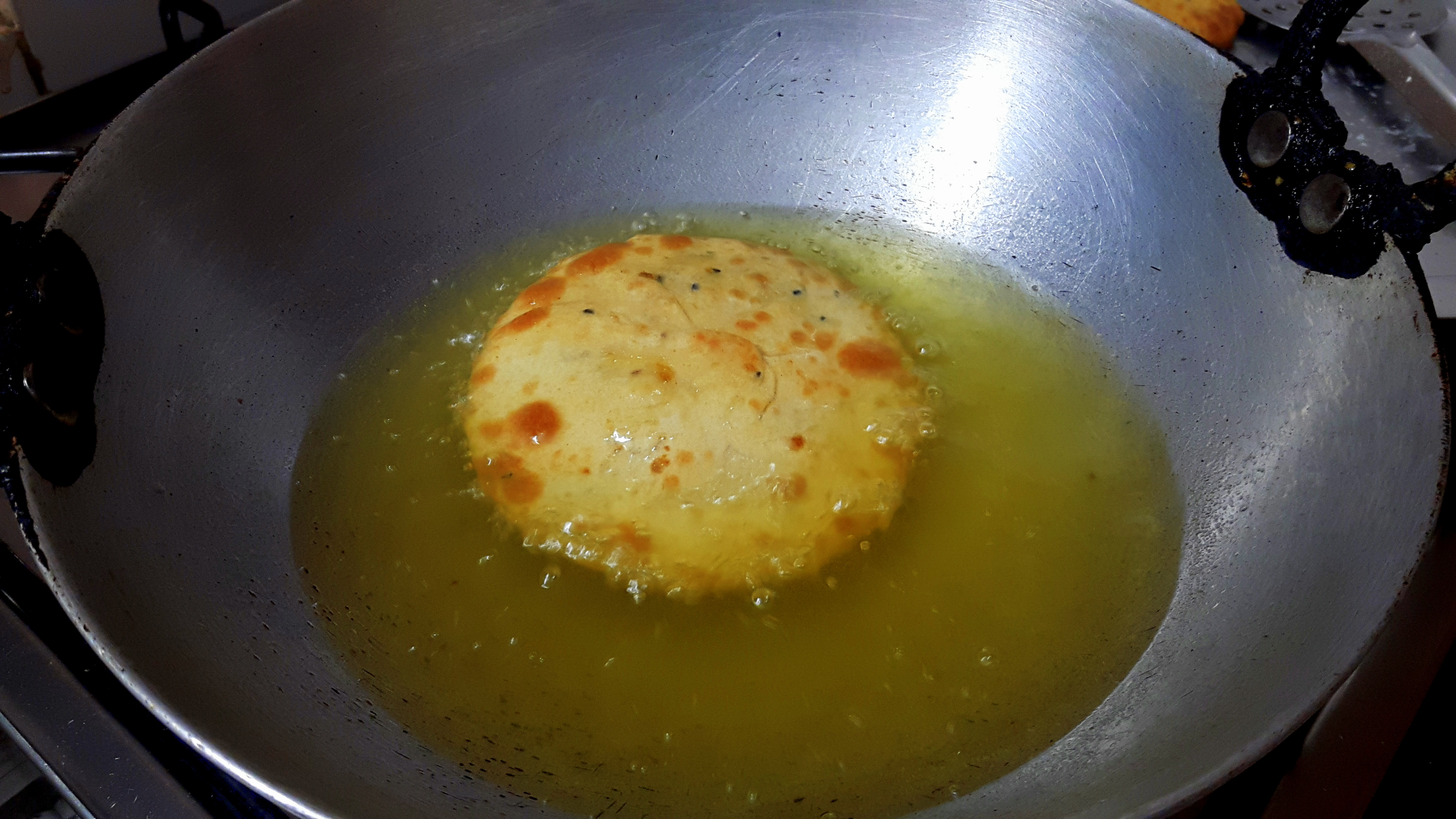 Deep fry the poori