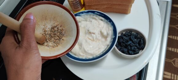 put curd, honey, cardamom powder and vanilla essence