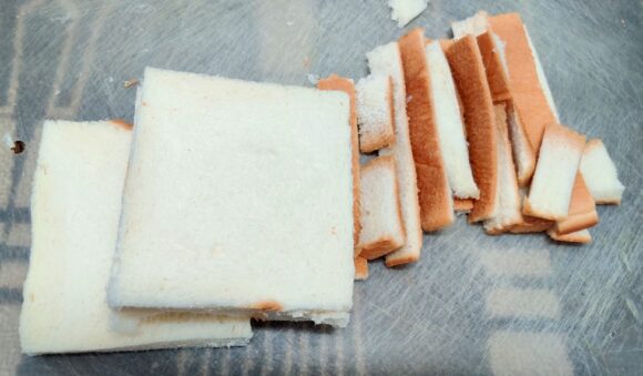 Remove the edges of bread slices by knife