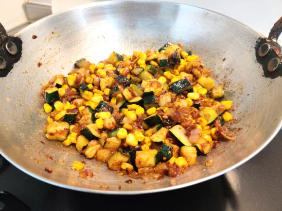 add Turmeric powder, Coriander powder, Chili powder, Dry mango powder and salt