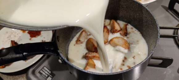 add prepared mixture of curd and Besan,