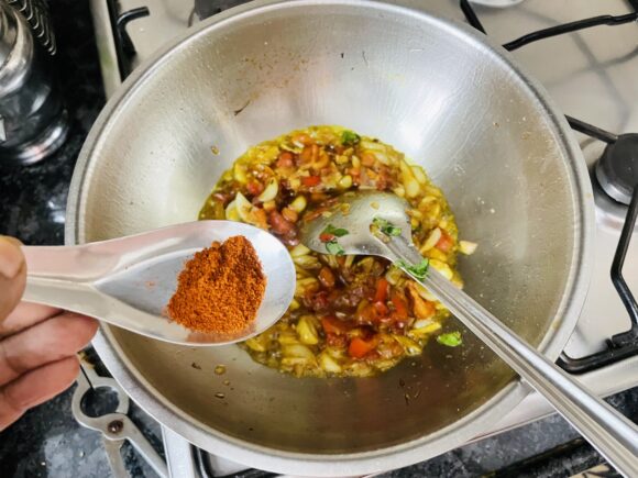 Add chopped tomatoes, coriander powder, chilli powder