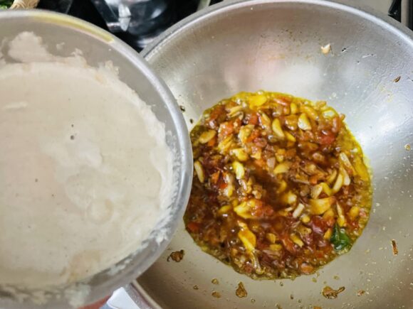 Add the ground peanuts, sesame and besan paste