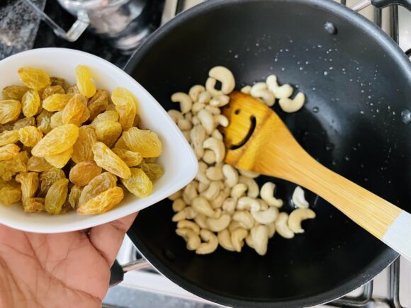 fry cashew nut on medium low flame add raisin 