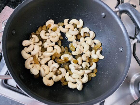 fry cashew nut on medium low flame add raisin 