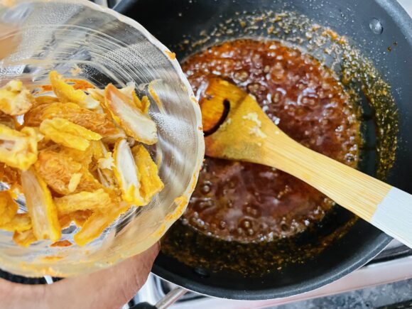 Add salt and soaked dry dates, fried cashew nut and raisin,